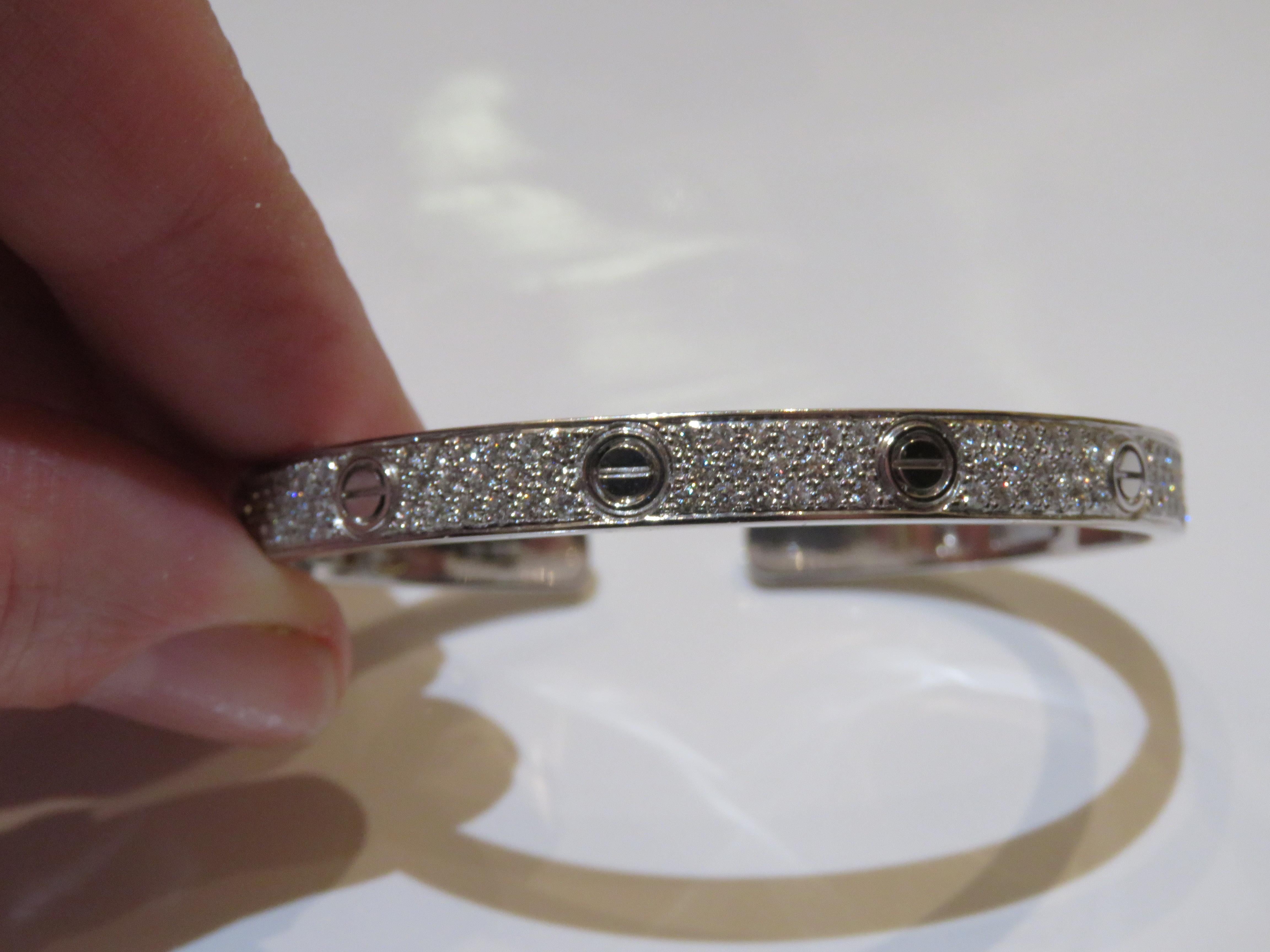 The Following Item we are offering is a Rare Pair Magnificent Radiant 18KT Gold Large Rare Gorgeous Fancy Diamond Screw Bangle Bracelets. Bracelets are comprised of Beautiful Glittering Rows of Gorgeous Diamonds with Screws!!! T.C.W. Approx