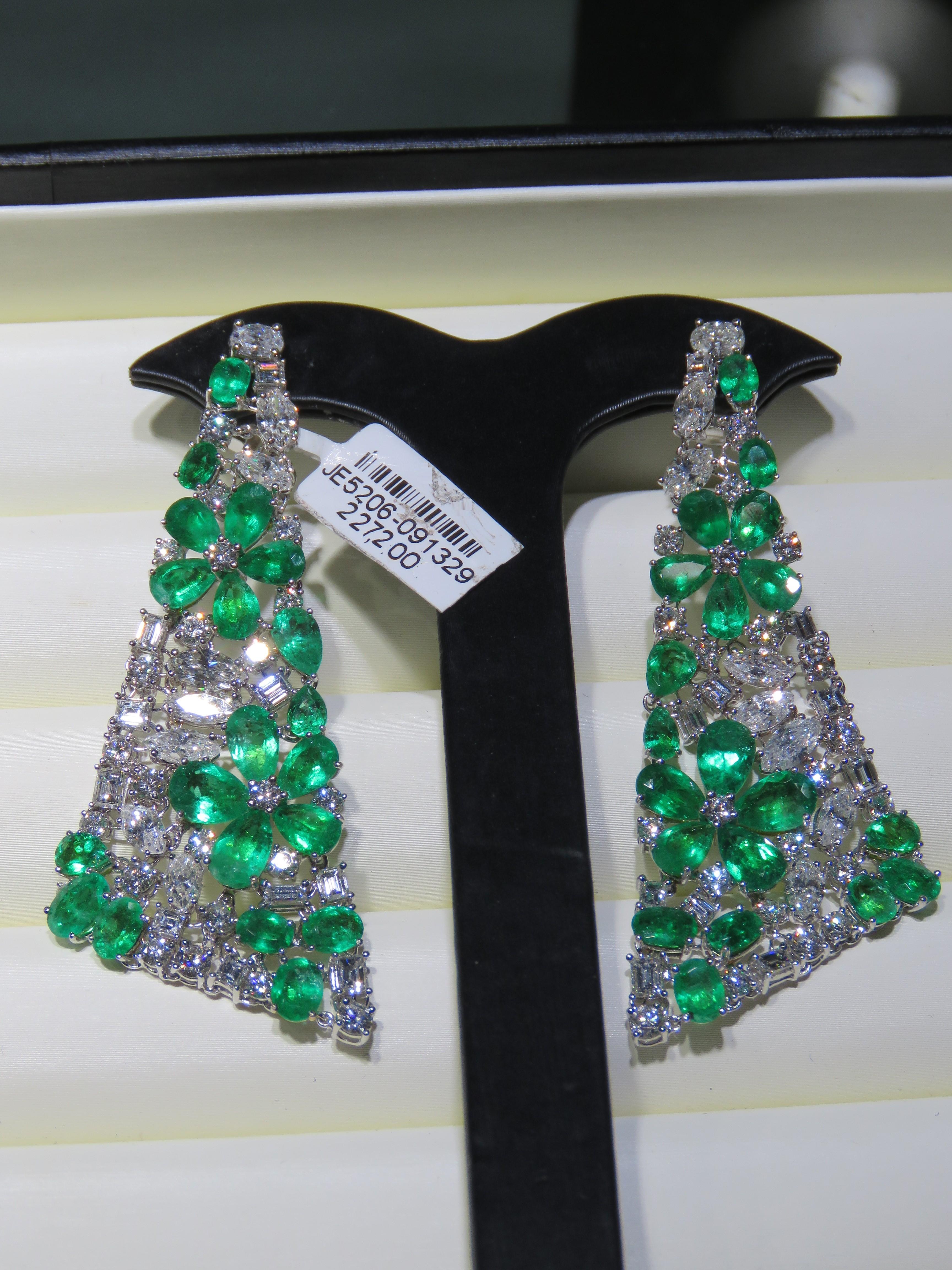 The Following Item we are offering is this Rare Important Radiant 18KT Gold Gorgeous Glittering and Sparkling Magnificent Fancy Colombian Emerald and Diamond Dangle Earrings. Earrings Contains approx 35CTS of Beautiful Fancy Cut Colombian Emeralds