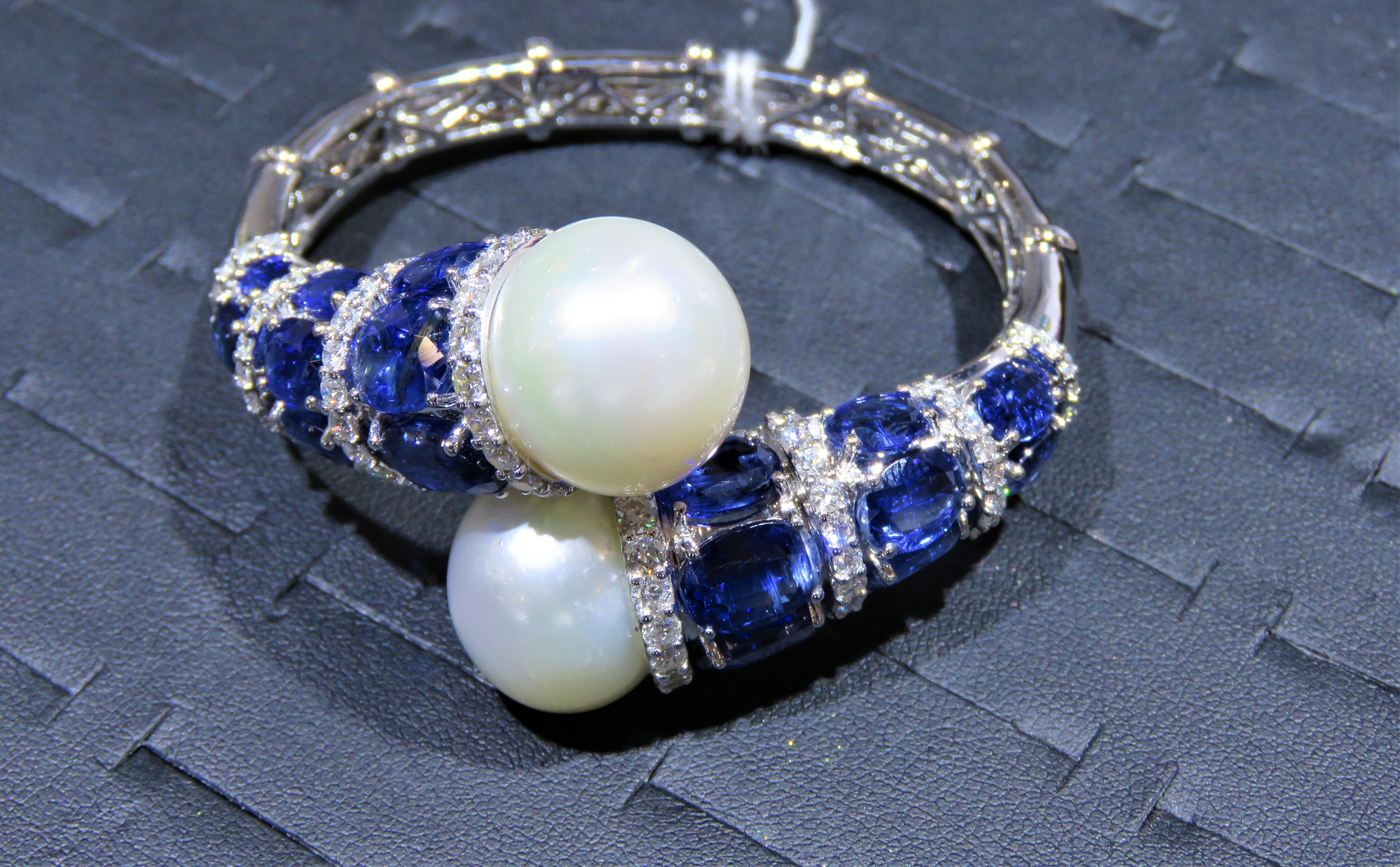 The Following Item we are offering is this Extremely Rare Beautiful 18KT Gold Fine Rare Large South Sea Pearl Crossover Fancy Blue Kyanite Diamond Bangle Bracelet. This Magnificent Bangle is comprised of Rare Fine Large South Sea Pearls and Royal