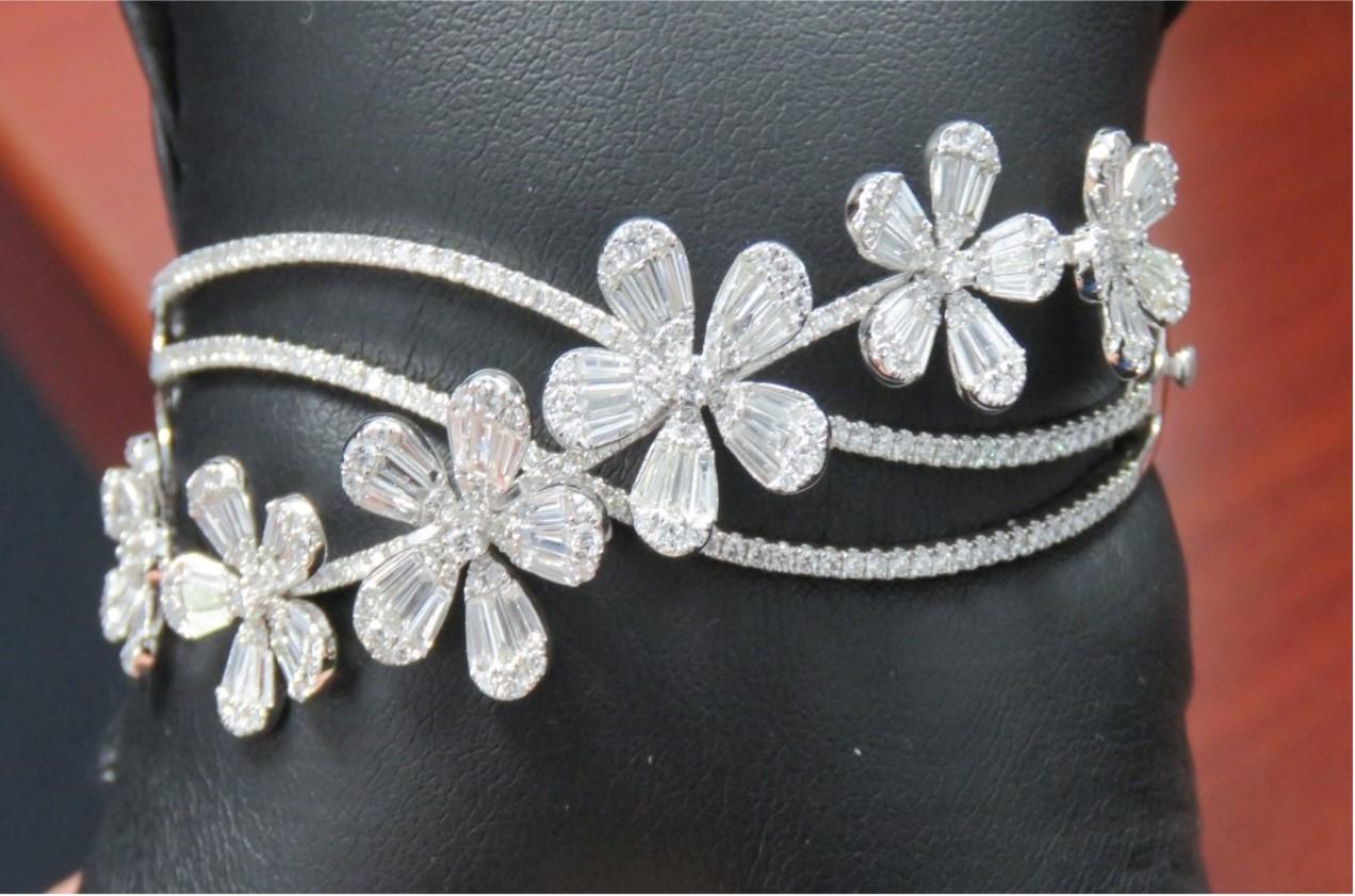 The Following Item we are offering is a Rare Important Radiant 18KT Gold Large Fancy Large Flower Diamond Bangle Bracelet Cuff.  Bracelet is comprised of Gorgeous Fancy Large Diamonds in the form of Flowers. T.C.W APPROX 4.50CTS!!! This Magnificent