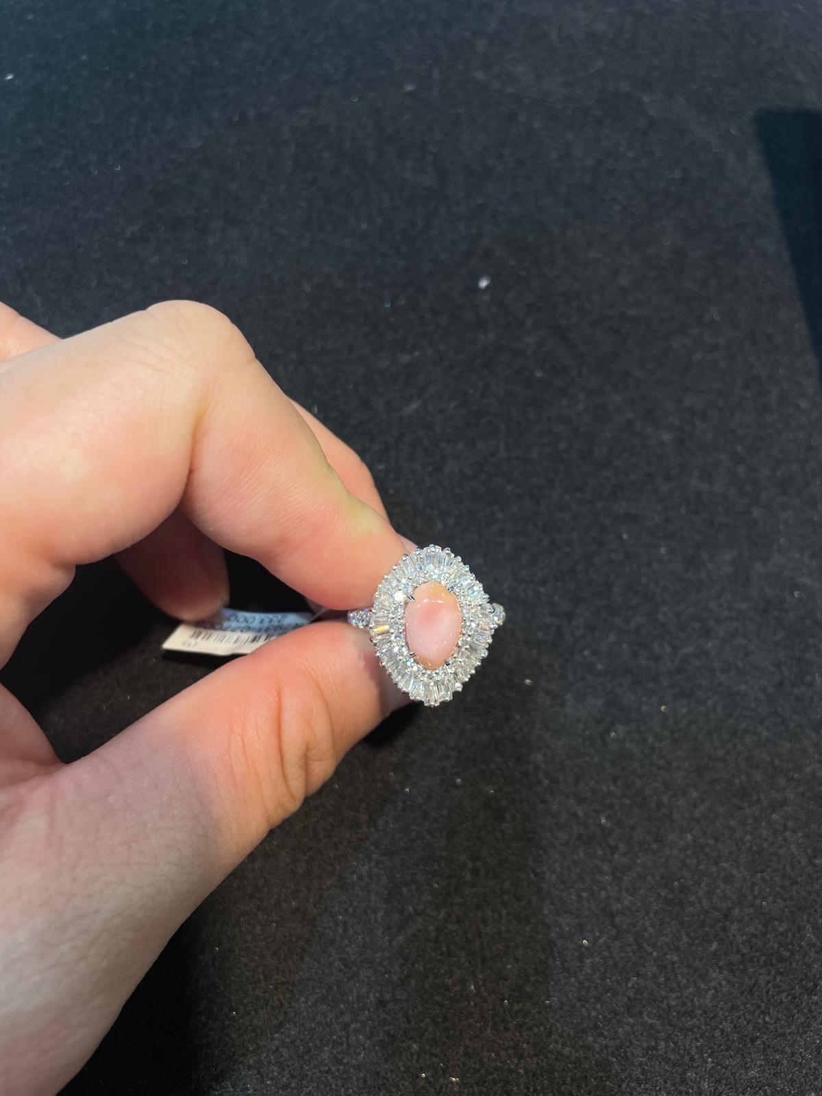 The Following Item we are Offering is this Magnificent 18KT Gold Large Extremely Rare Conch Pearl and Fancy Trillion Baguette Diamond Ring. This Gorgeous Ring features a Large Gorgeous Conch Pearl sitting atop Fancy Glittering Trillion Baguette