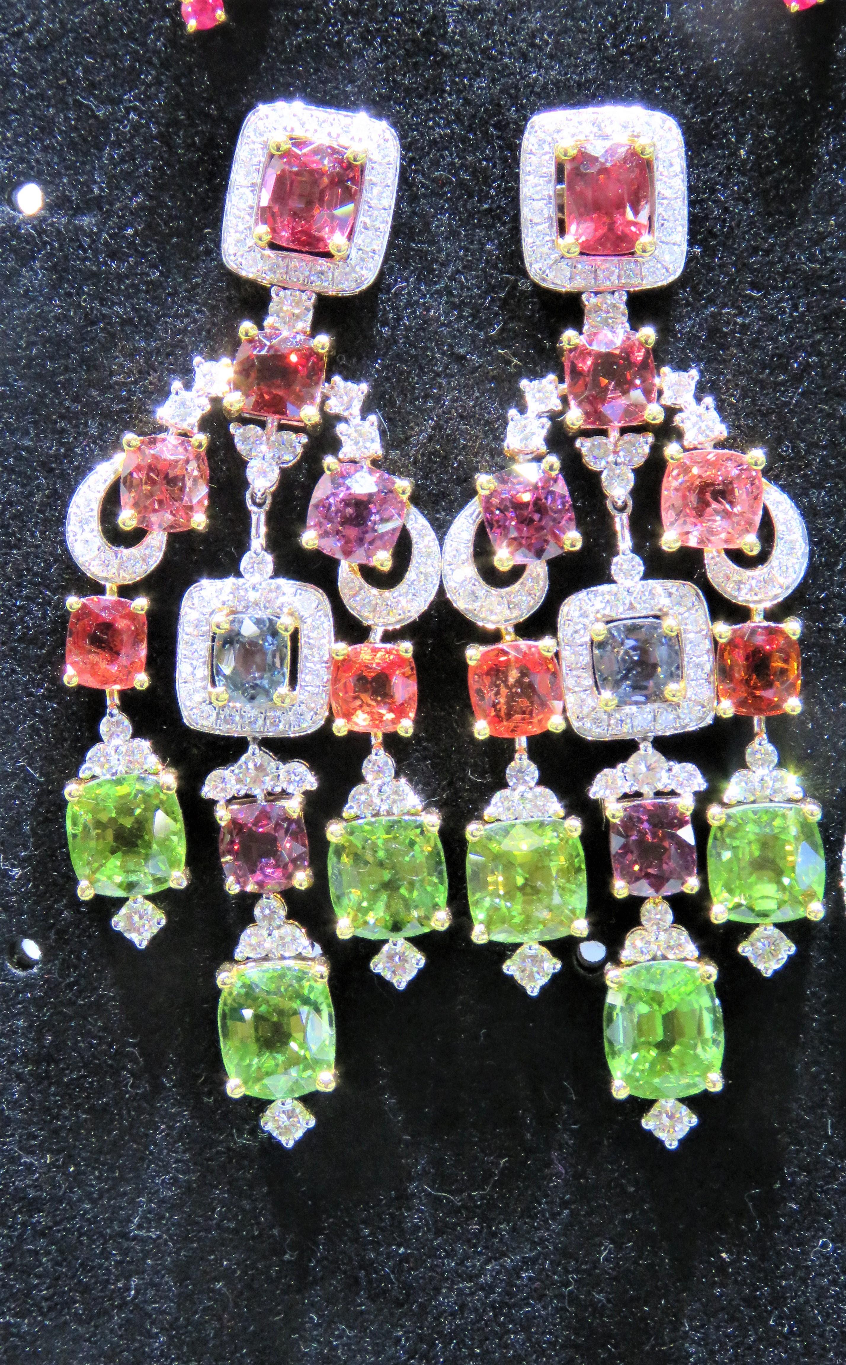 The Following Items we are offering is this Rare Important Radiant 18KT Gold Gorgeous Glittering and Sparkling Magnificent Fancy Rainbow Multi Color Spinel Diamond Dangle Earrings. Earrings contain approx 28CTS of Beautiful Fancy Colored Spinels and