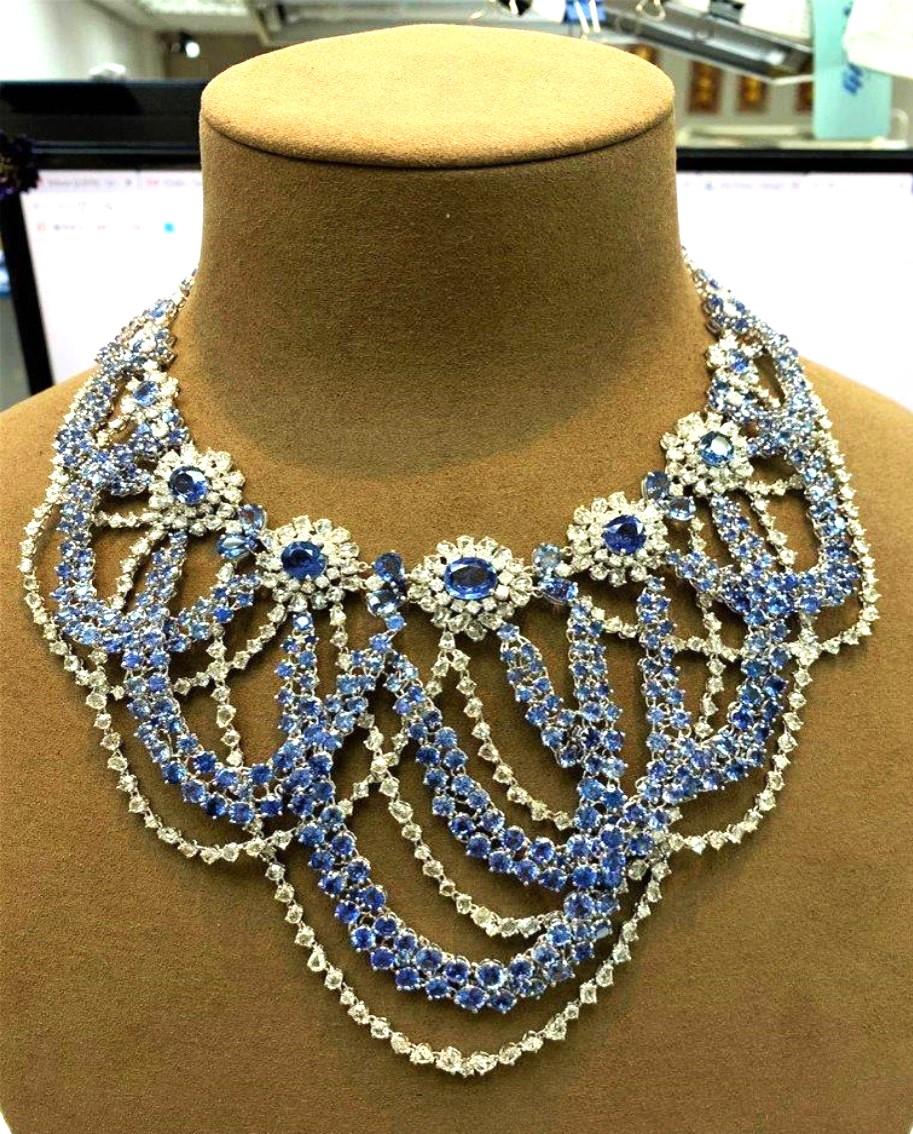 The Following Items we are offering is a Rare Important Radiant 18KT White Gold Elaborate Design Necklace with Magnificent Rare Sparkling Sapphires Flanked by Fine Glittering Diamonds. An Outstanding Masterpiece. Diamond Weight approx 36CTS, Gold