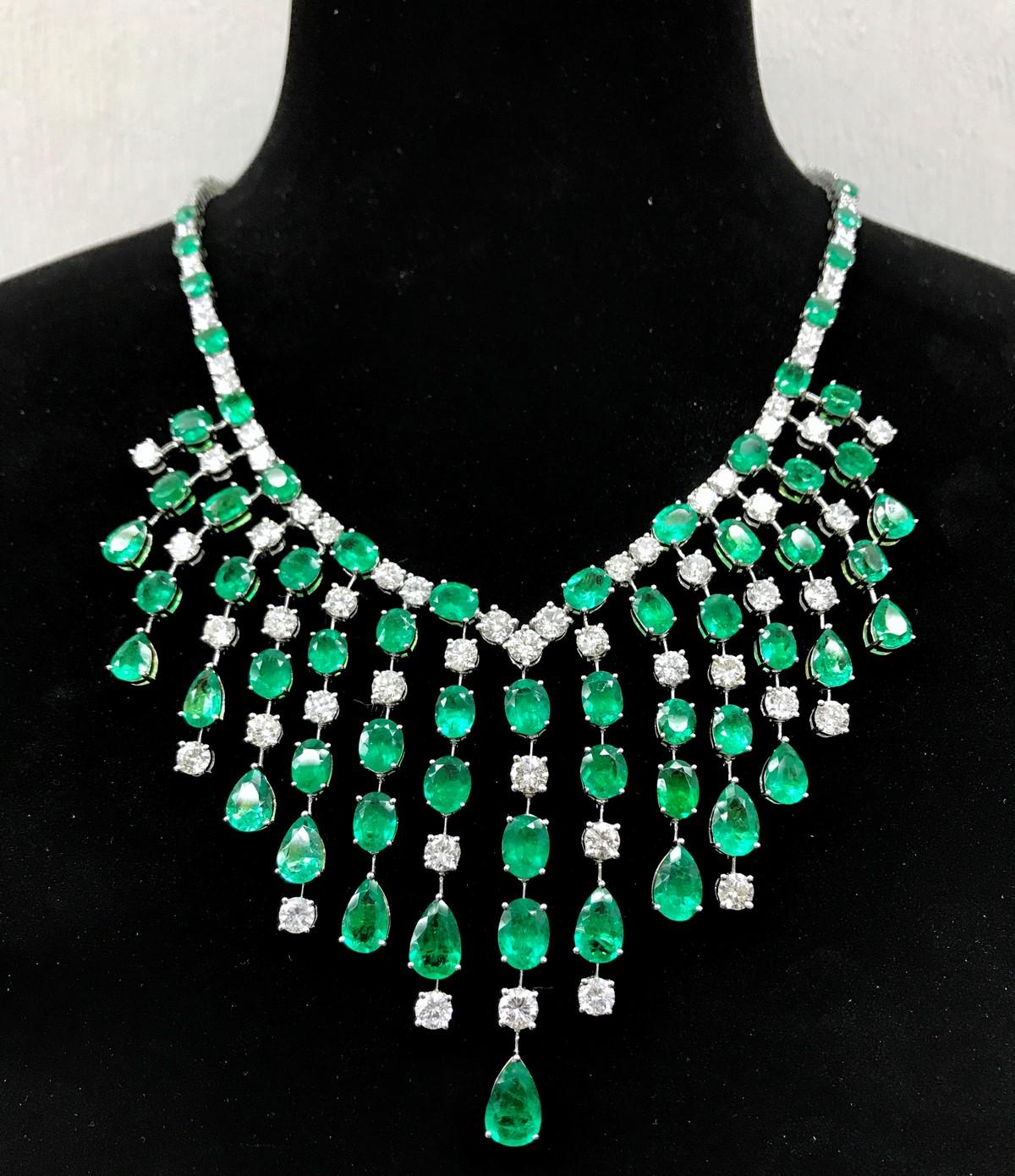 The Following Items we are offering is a Rare Important Radiant 18KT White Gold Fancy Winston Style Glistening Diamond and Emerald Necklace consisting of Magnificent Emeralds and Diamonds. Each Fringe contains Spectacular Emeralds and Diamonds.