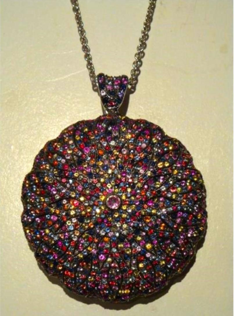 The Following Items we are offering is a Spectacular and Beautiful Pendant Necklace with Fine Cut and Handset MULTI COLORED AND FACETED SAPPHIRE STONES. Stones are of Extremely Fine Quality and Magnificently Done. Total Carat Weight Approx: 12CTS!!!