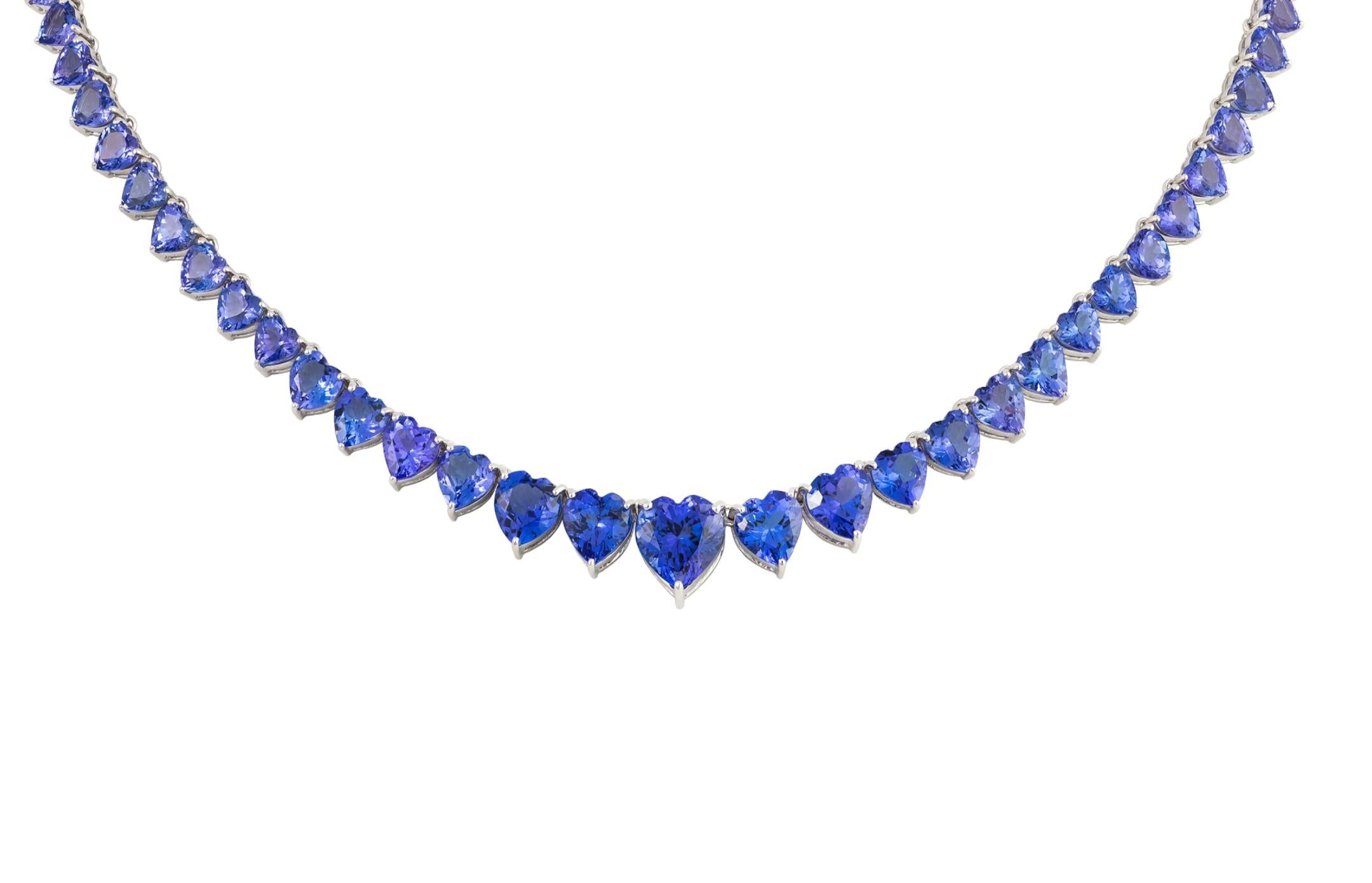 The Following Item we are offering is a Rare Important Spectacular and Brilliant 18KT Gold Large Gorgeous Graduated Tanzanite Heart Strand Necklace. Necklace consists of Rare Fine Magnificent Rare Heart Shaped Tanzanites!! T.C.W. Approx 31CTS!!!