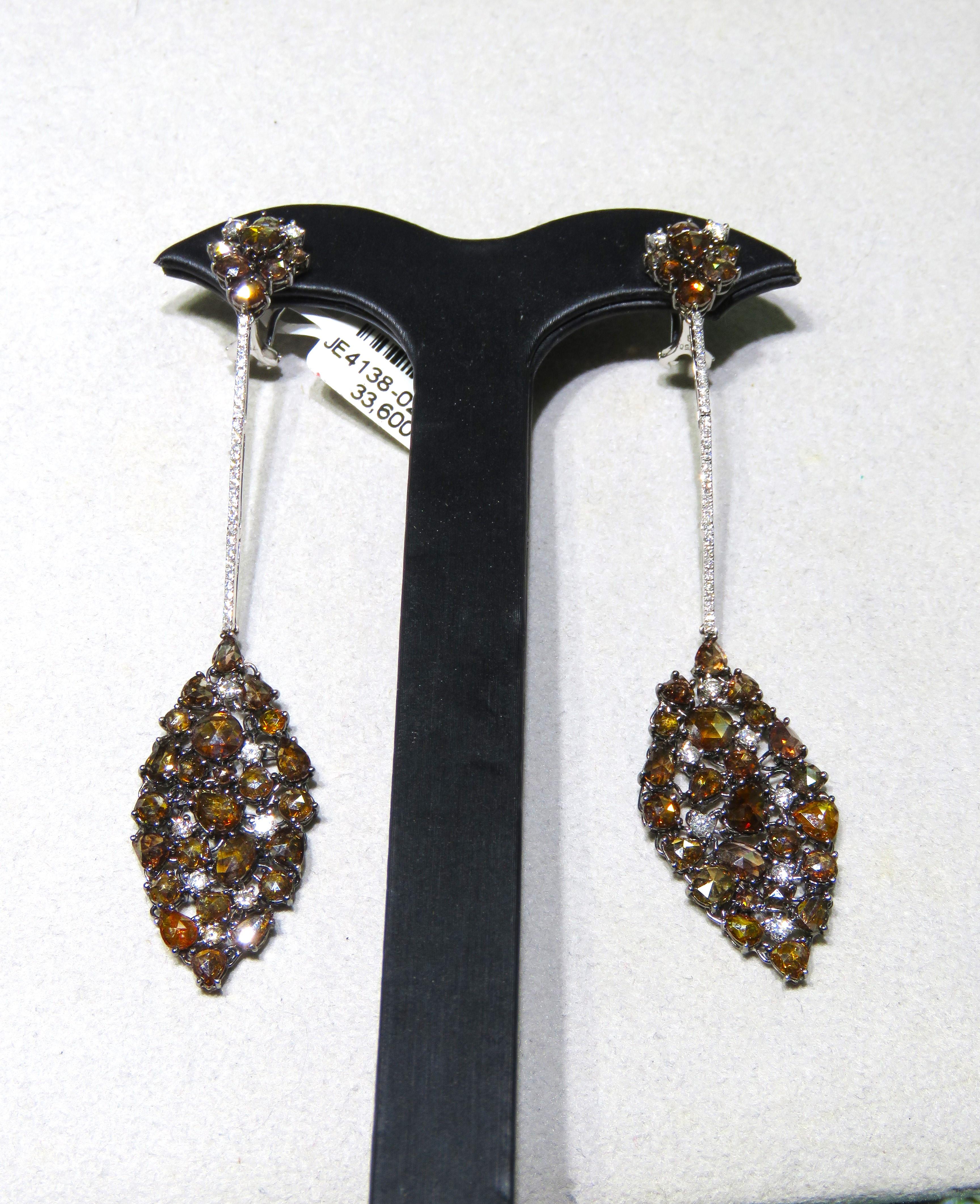 The Following Item we are offering are these Extremely Rare Beautiful 18KT Gold Fine Large Fancy Orange and Cognac Diamond Dangle Earrings. Each Earring features Rare Gorgeous Glittering Fancy Orange and Cognac Diamonds Draped with Sparkling White