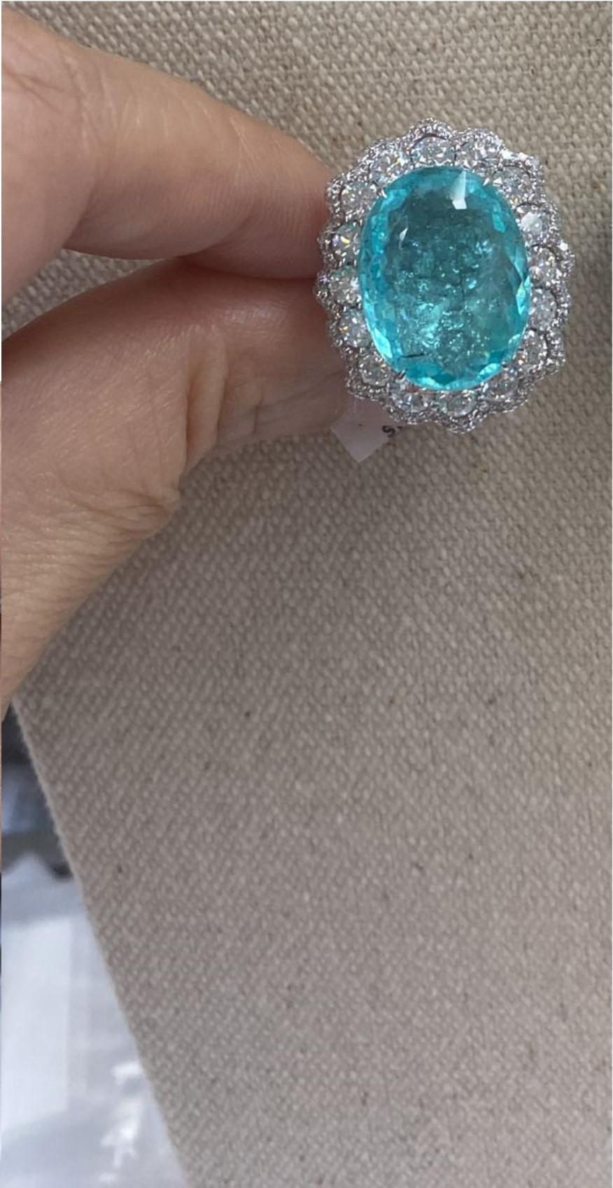 The Following Items we are offering is a Rare Important Spectacular and Brilliant 18KT Gold Large Massive Gorgeous Paraiba and Diamond Ring. Ring consists of Rare a Large Fine Magnificent Paraiba Tourmaline surrounded and Framed with Gorgeous