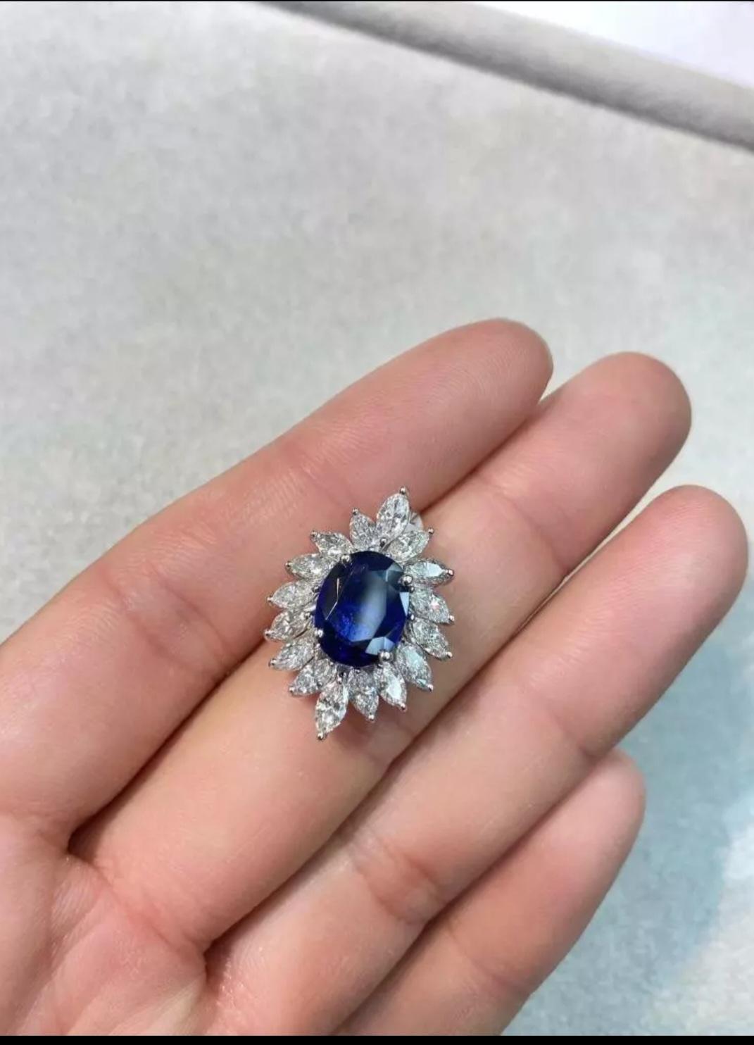 The Following Items we are offering is a Gorgeous Radiant 18KT White Gold Rare Natural Blue Sapphire and Brilliant Cut Diamond Pendant. Pendant is comprised of a Rare Large 3CT Natural Exquisite Glittering Blue Sapphire surrounded with 3CTS  of