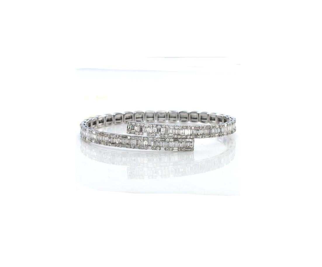The Following Item we are offering is this Beautiful Rare Important 18KT White Gold Certified Brilliant White Diamond Bangle Bracelet. Bangle is comprised of Magnificent Rare Gorgeous Cascasding White Diamonds that wraps around arm!!! T.C.W. approx