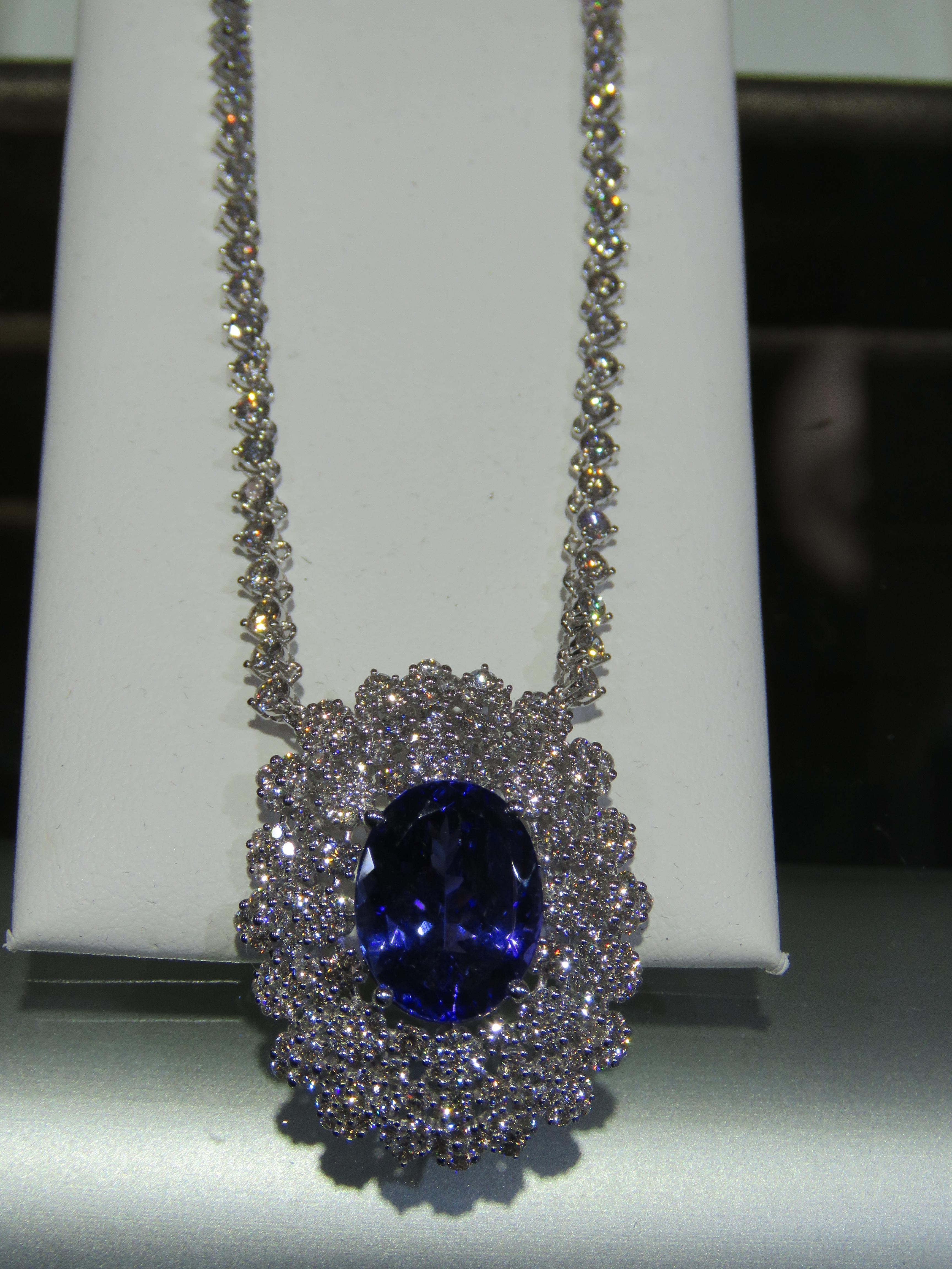 The Following Item we are offering is this Rare Important Radiant 18KT Gold Gorgeous and Sparkling Magnificent Fancy Tanzanite and Diamond Necklace. Necklace features approx 16CTS of a Beautiful Fancy Tanzanite and Glittering Diamonds!!! This