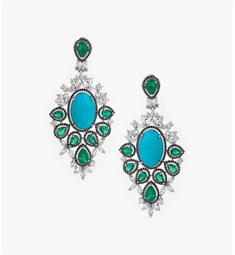 The Following Items we are offering is a Pair of Rare 18KT Gold Large Emerald Diamond Dangle Earrings. Earrings are comprised of Finely Set Gorgeous Large Oval Gorgeous Turquoise Green Emerald Diamond Earrings. Turquoise is surrounded with Large