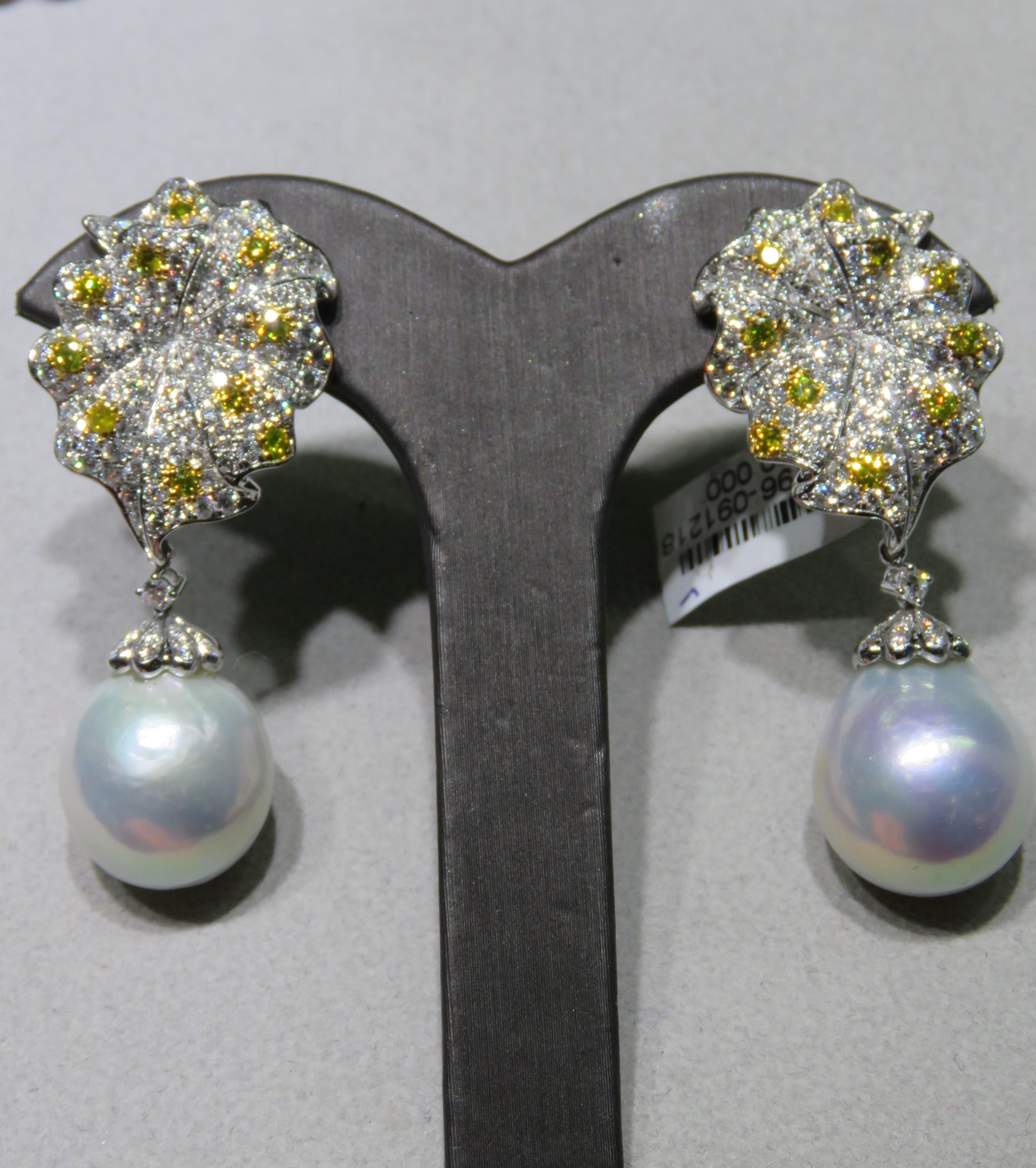 The Following Item we are offering are these Extremely Rare Beautiful 18KT Gold Fine Large Fancy South Sea White Pearl, White Diamond, and Yellow Diamond Detachable Leaf Dangle Earrings. Each Earring features Gorgeous a Magnificent Fine Fancy Large