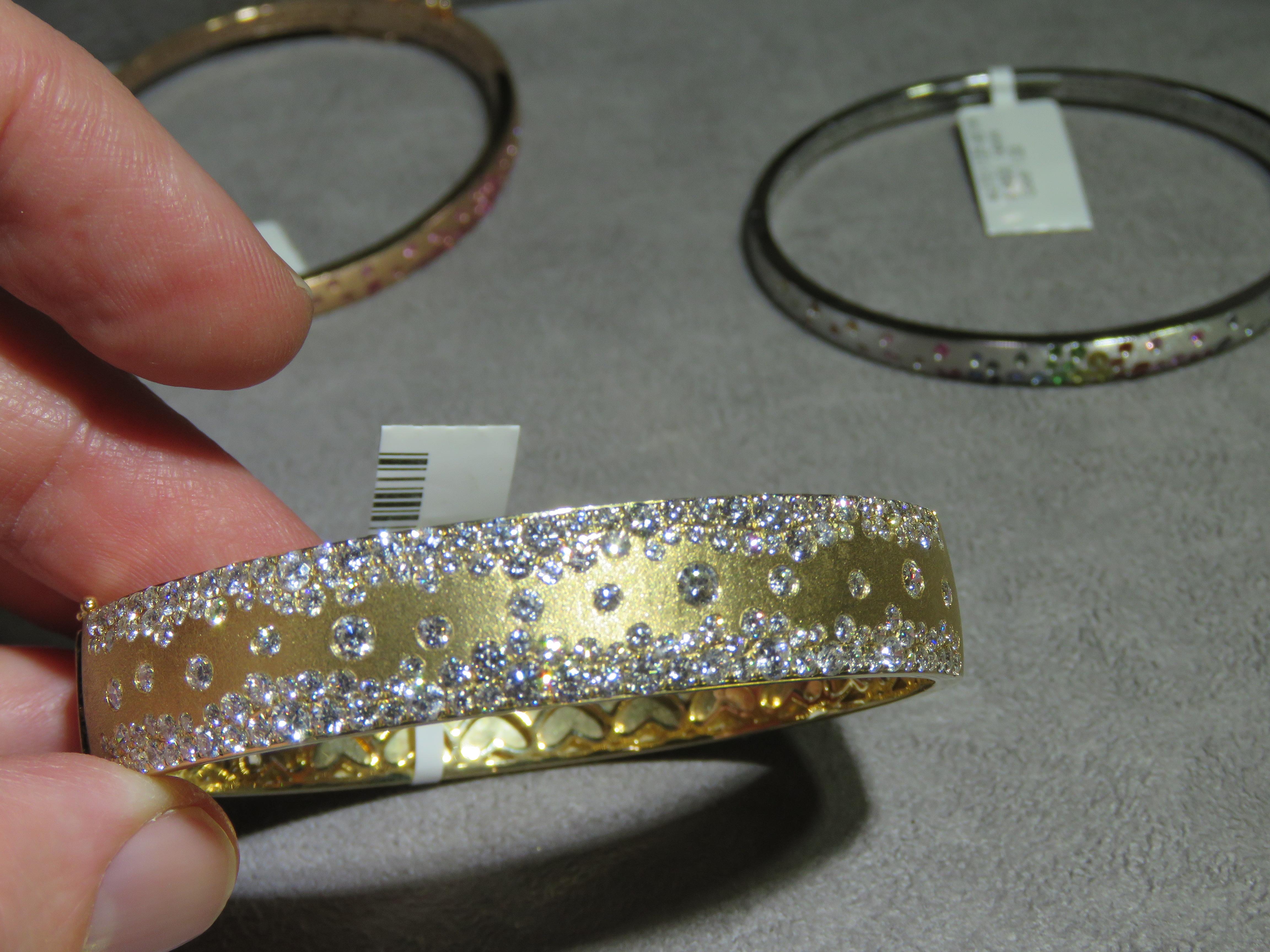The Following Item we are offering is a Rare Magnificent Radiant 18KT Yellow Gold Large Rare Gorgeous Fancy Diamond Bangle Bracelet. Bracelet is comprised of Beautifu Gorgeous Glittering Diamonds!!! T.C.W. Approx 5CTS!!! This Gorgeous Bangle is a