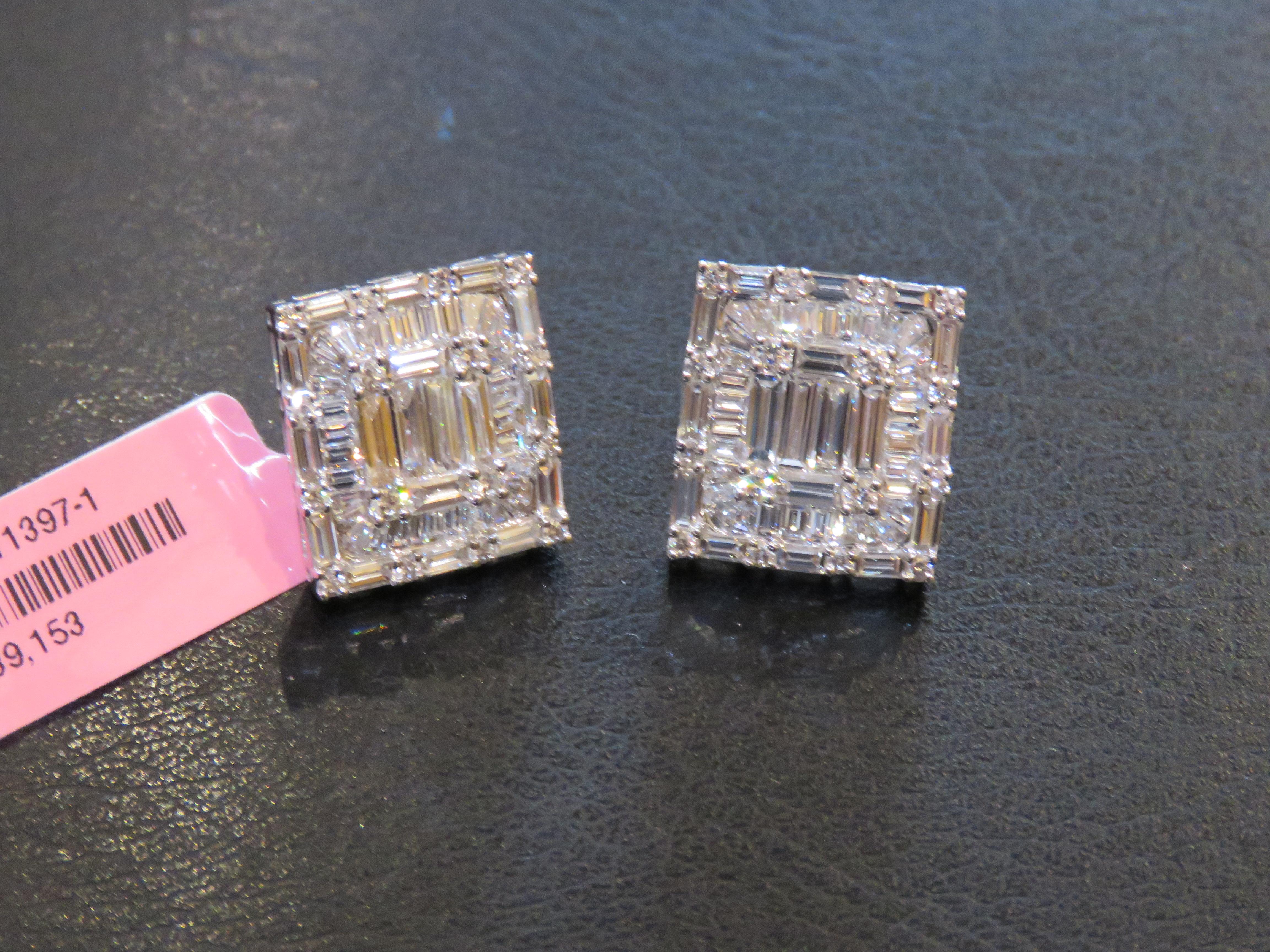 The Following Item we are offering are these Beautiful Important Rare 18KT White Gold Brilliant Large 4CT Emerald Cut Diamond Stud Earrings. Each Earring is Magnificently adorned with a Beautiful Halo and are comprised of Magnificent Glittering