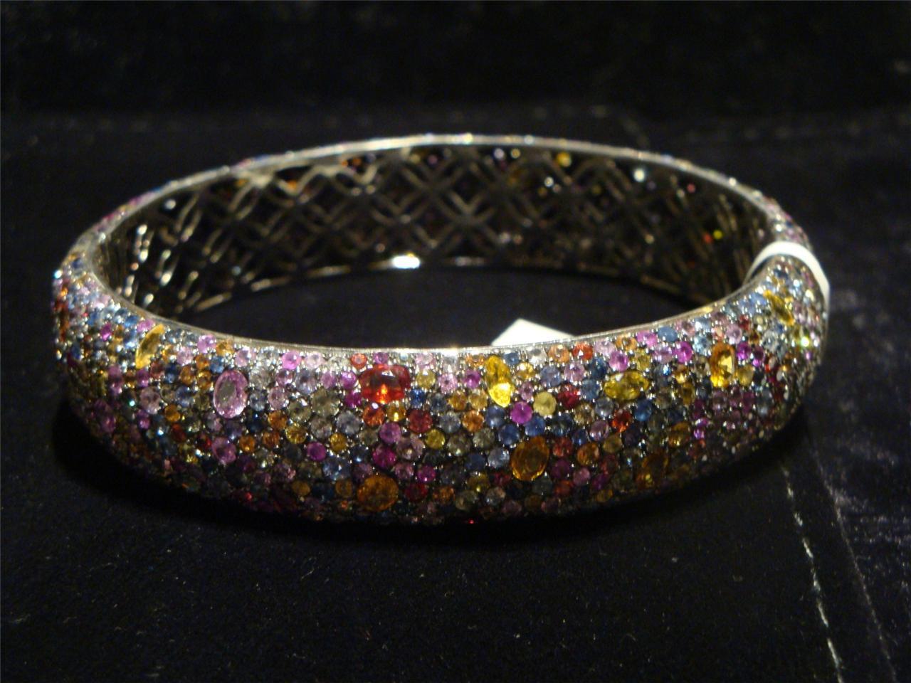 The Following Item we are offering is this Rare Magnificent FANCY COLORFUL RAINBOW SAPPHIRE STERLING SILVER CUFF BANGLE BRACELET. T.C.W. APPROX 30CTS!!! This Magnificent Bangle is a Rare Sample Piece that were sold in select Five Star Hotels and