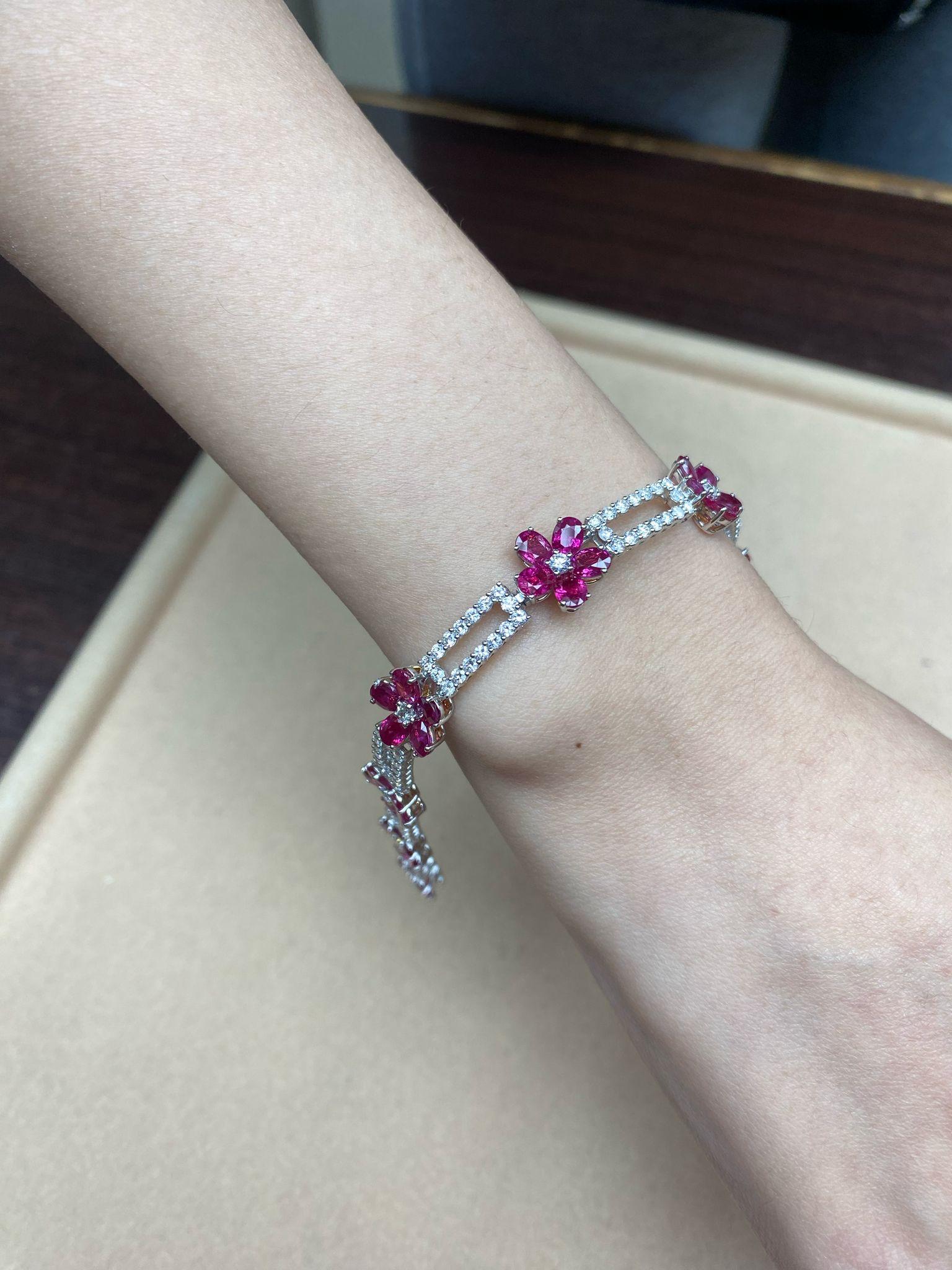 The Following Item we are offering is this Rare Important Radiant 18KT Gold Gorgeous Glittering and Sparkling Magnificent Fancy Rare Ruby and Diamond Bracelet. Bracelet contains approx 13CTS of Beautiful Fancy Rubies forming Flowers surrounded with