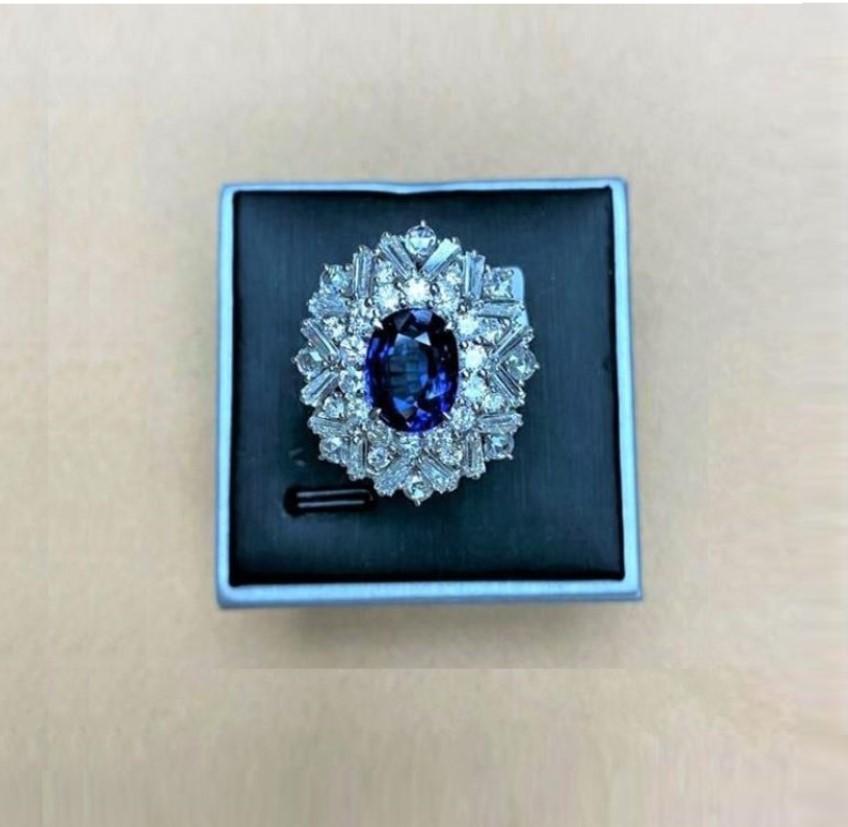 The Following Item we are offering is a Rare Important Radiant 18KT Gold Large Rare Fancy Blue Sapphire and Diamond Ring. Ring is comprised of Gorgeous Blue Sapphires Spectacularly Set in and surrounded by Magnificent Glittering Round and Trillion