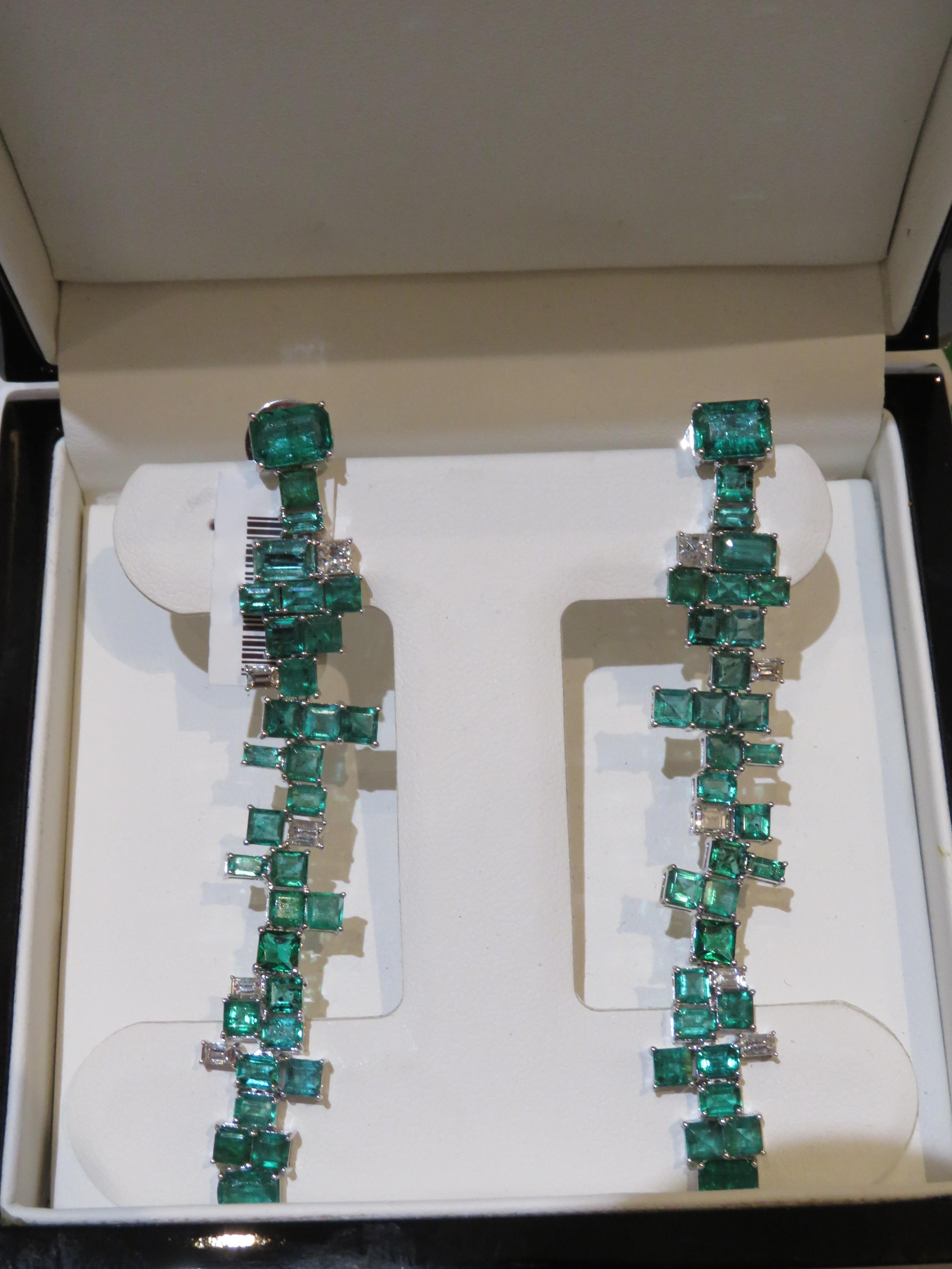 The Following Item we are offering is a Rare Important Radiant 18KT Gold Pair of Large Rare Gorgeous Emerald and Diamond Dangle Earrings. Earrings are comprised of Beautiful Glittering Dangling Emeralds and Glittering Diamonds T.C.W. approx 13CTS!!!