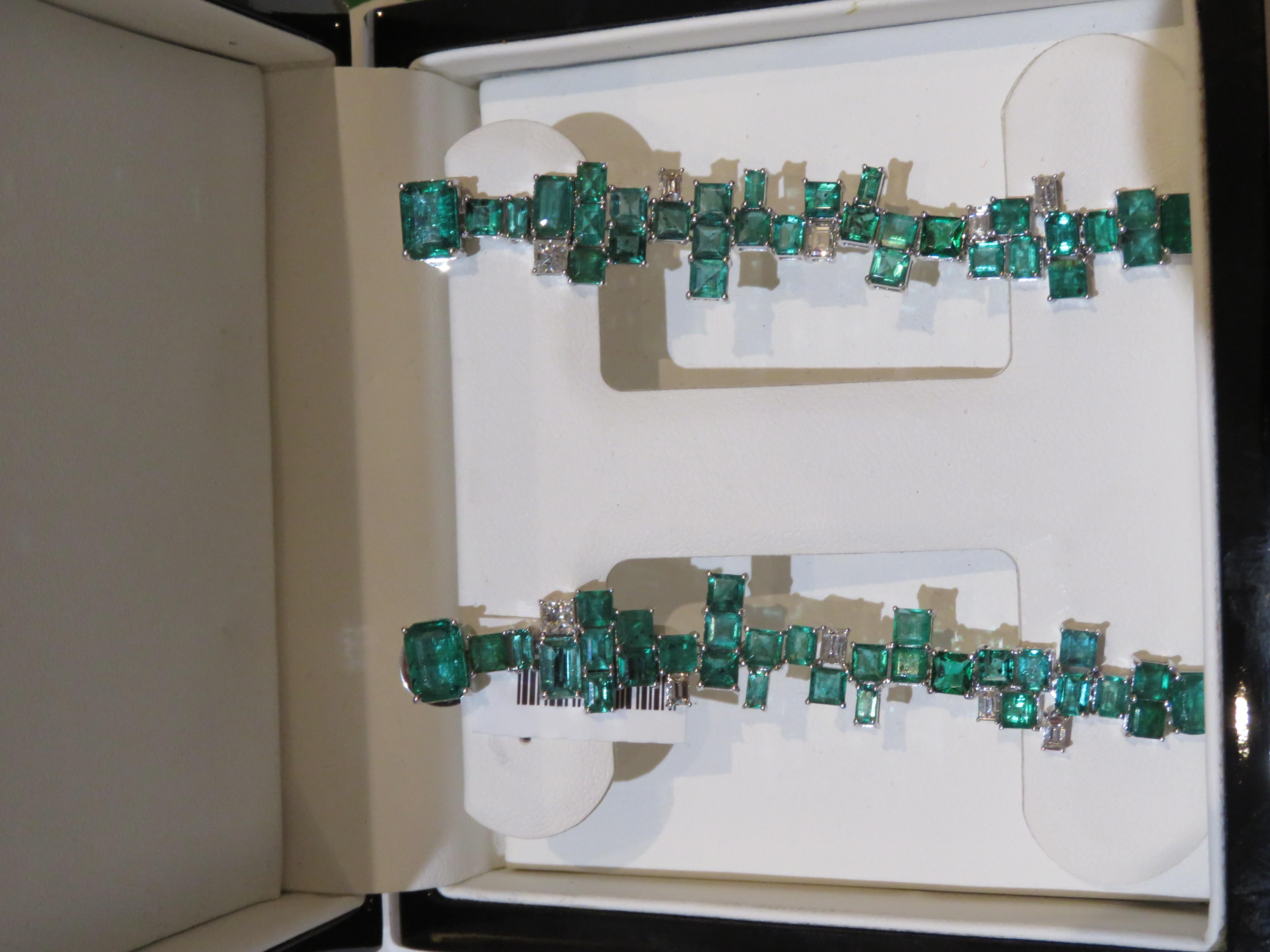 The Following Item we are offering is a Rare Important Radiant 18KT Gold Pair of Large Rare Gorgeous Emerald and Diamond Dangle Earrings. Earrings are comprised of Beautiful Glittering Dangling Emeralds and Glittering Diamonds T.C.W. approx 13CTS!!!
