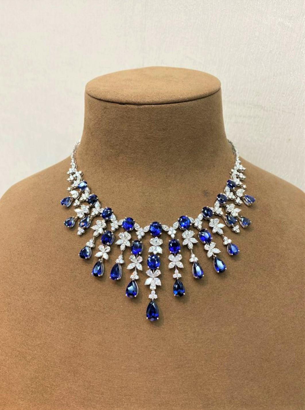 The Following Item we are offering is this Rare Important Radiant 18KT Gold Gorgeous Glittering and Sparkling Magnificent Fancy Natural Sapphires and Diamond Fringe Necklace. Necklace contains approx 70CTS of Beautiful Fancy Natural Sapphires and