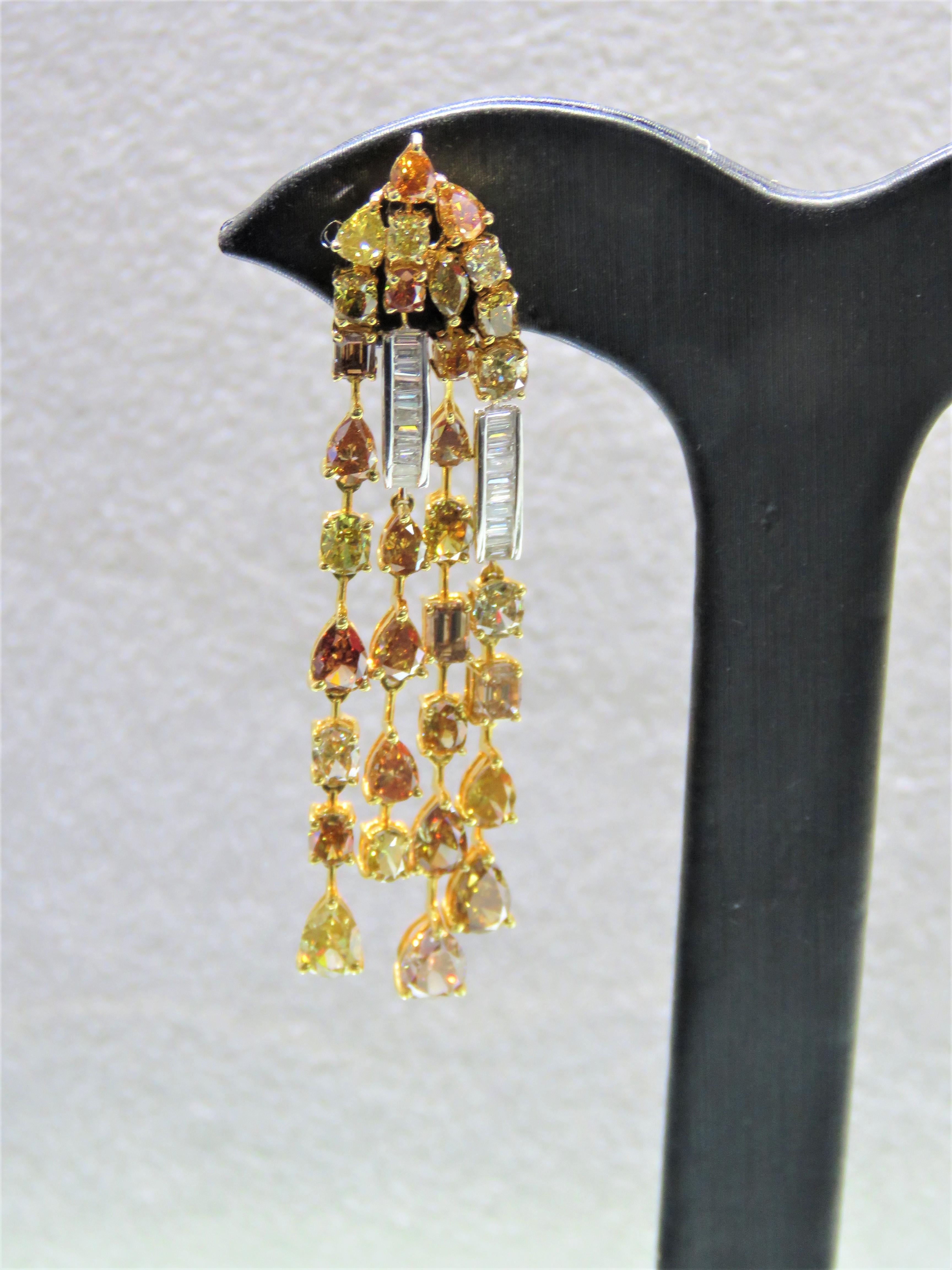 The Following Item we are offering are these Extremely Rare Beautiful 18KT Gold Fine Large Fancy Yellow and White Diamond Dangle Earrings. Each Earring features Rare Gorgeous Glittering Fancy Large Yellow, Cognac, and Orange Diamonds Draping with