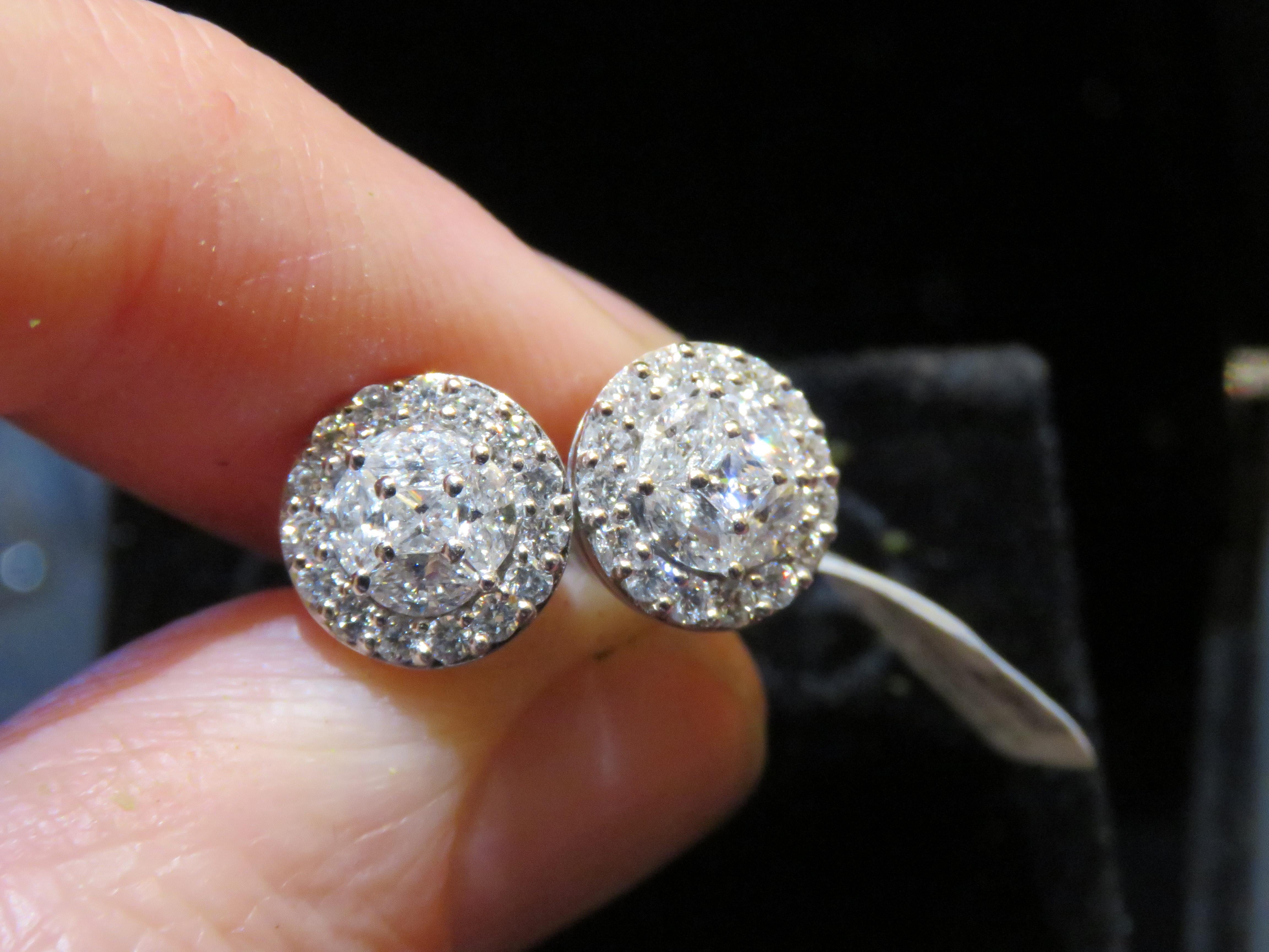 The Following Items we are offering is a Rare Important Radiant 18KT White Gold Stunning Diamond Round Halo Stud Earrings. Earrings feature Magnificent Rare Sparkling Fine Glittering Fancy Shaped Diamonds!! T.C.W. Approx over 1CT!!! These Gorgeous