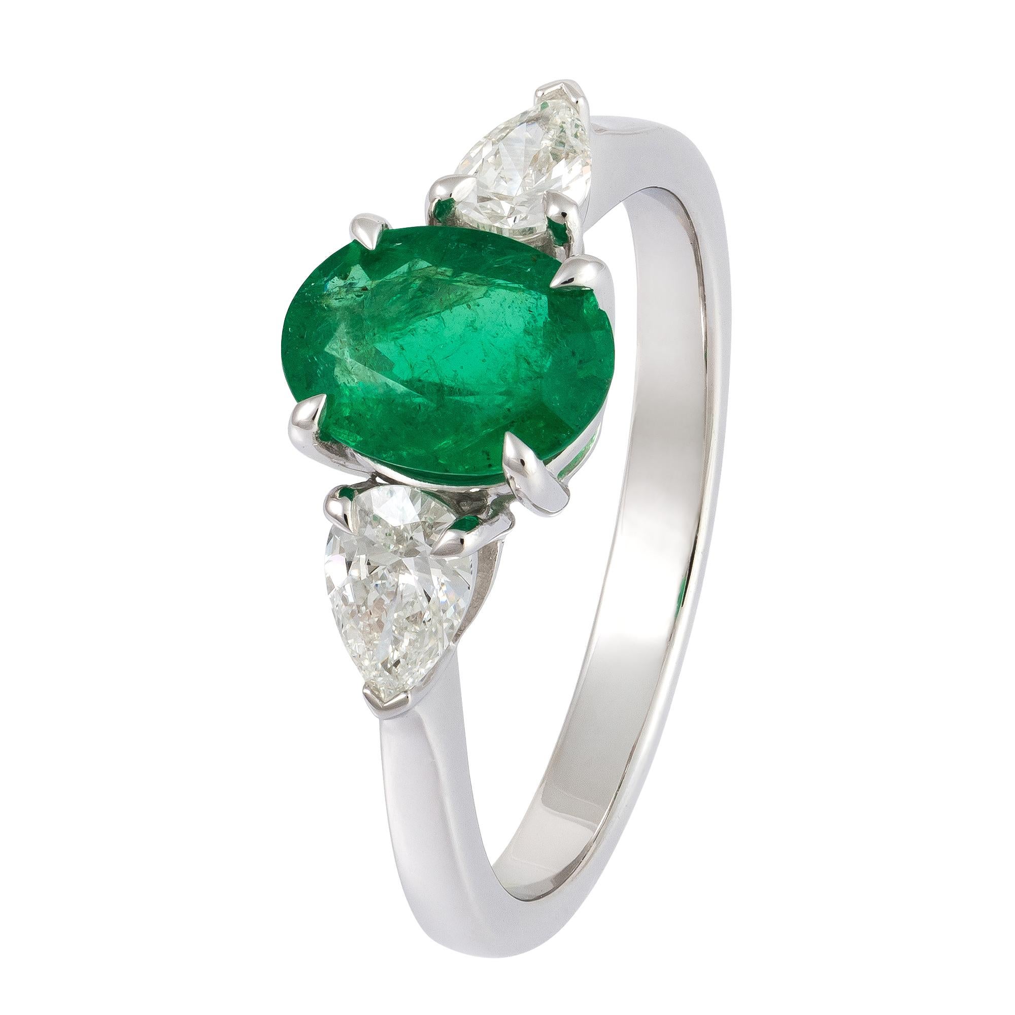 The Following Item we are offering is this Rare Important Radiant 18KT Gold Gorgeous Glittering and Sparkling Magnificent Fancy Oval Shaped Green Emerald and Fancy Pear Shaped Diamond Ring. Ring Contains approx 2CTS of Beautiful Fancy Oval Cut
