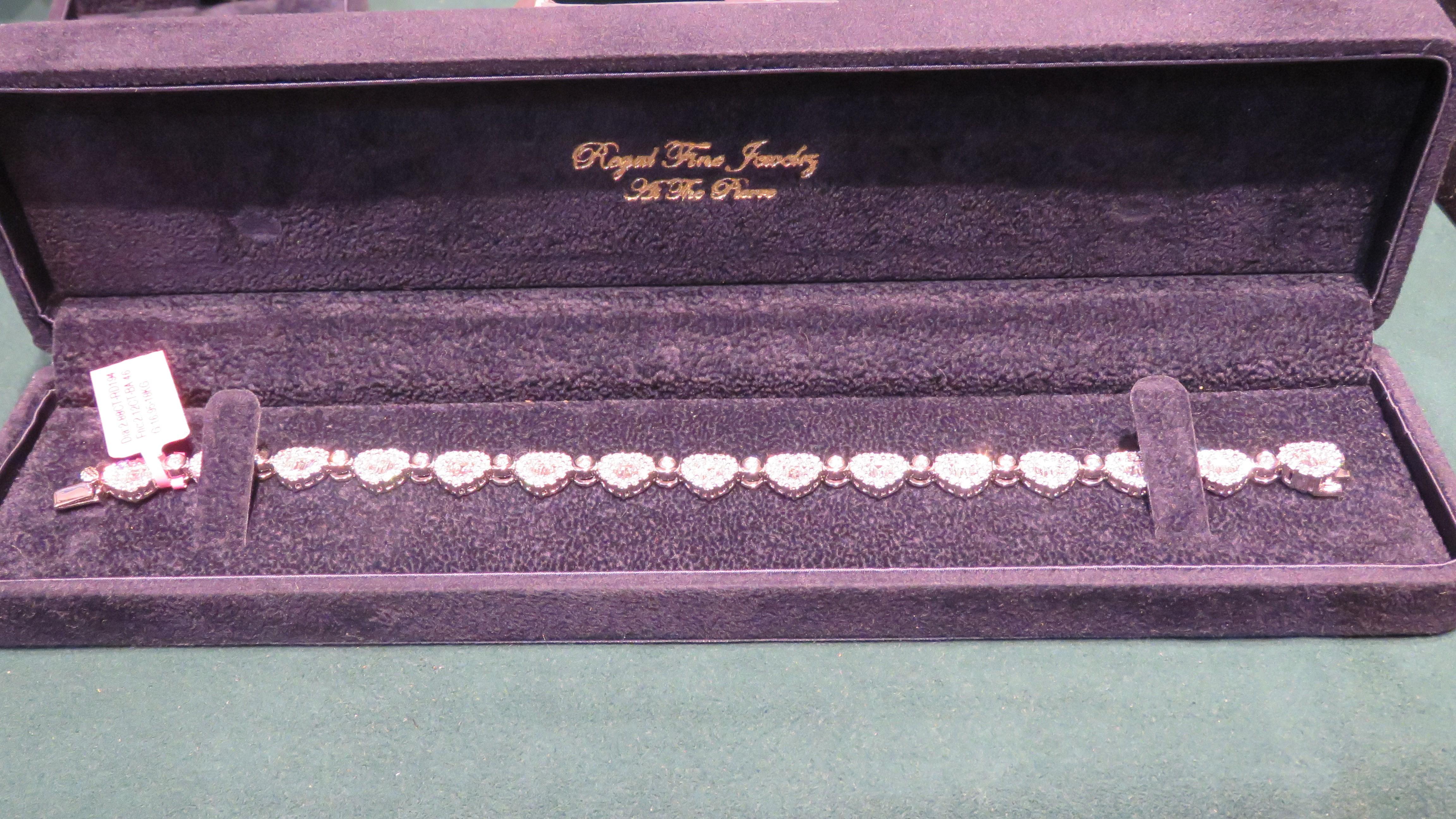 
The Following Item we are offering is a Rare 18KT Gold Heart Shaped Diamond Tennis Bracelet. Bracelet is comprised of Finely Set Gorgeous Glittering Diamonds. T.C.W. Over 5CTS. TheDiamonds are of Exquisite and Fine Quality. This Gorgeous Bracelet