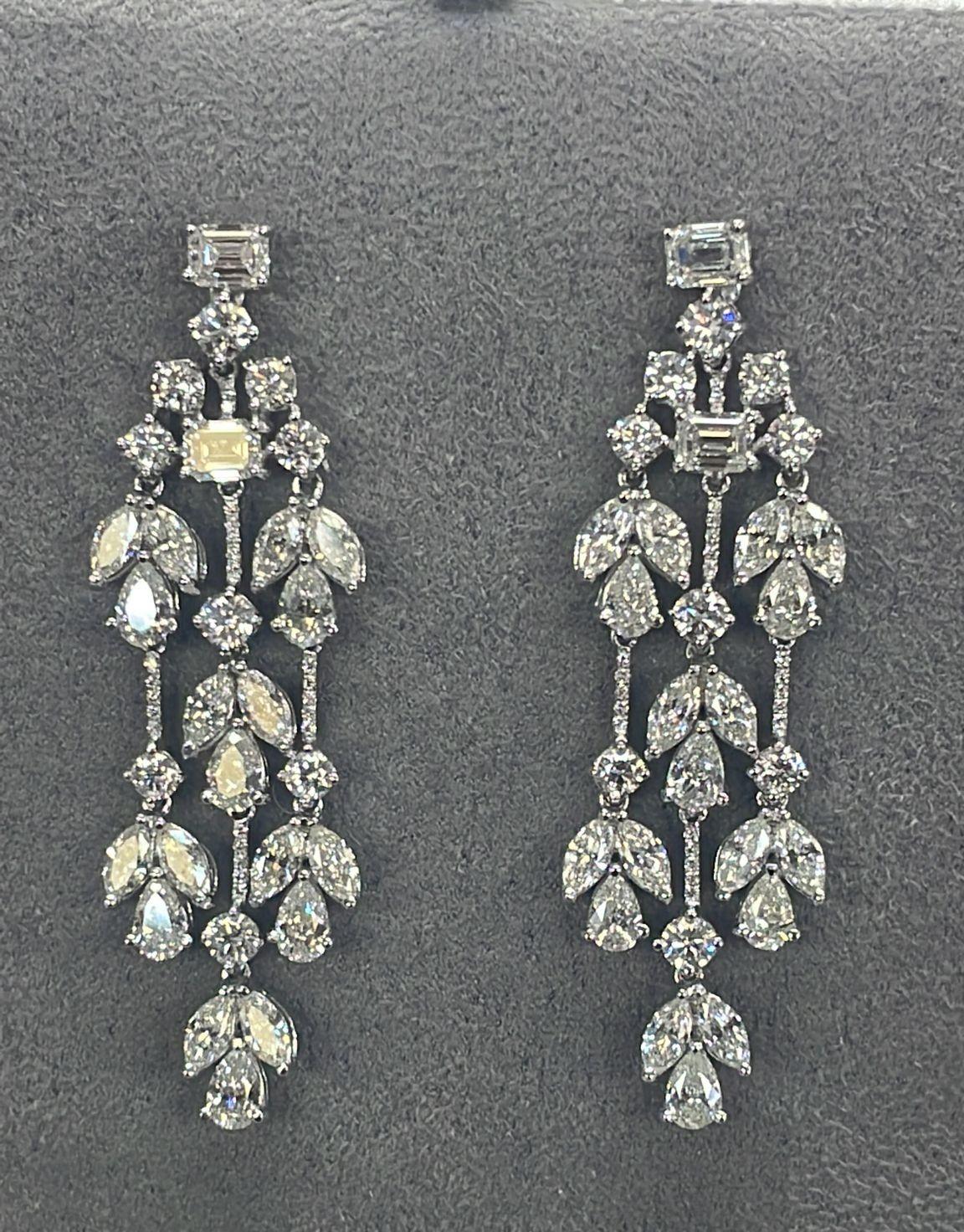 
The Following Items we are offering is a Rare Important Radiant 18KT Gold Glamorous and Elaborate Rare Magnificent Glittering White Diamond Chandelier Earrings. Earrings feature Rare Sparkling White Diamonds set in 18KT Gold!! T.C.W. Approx