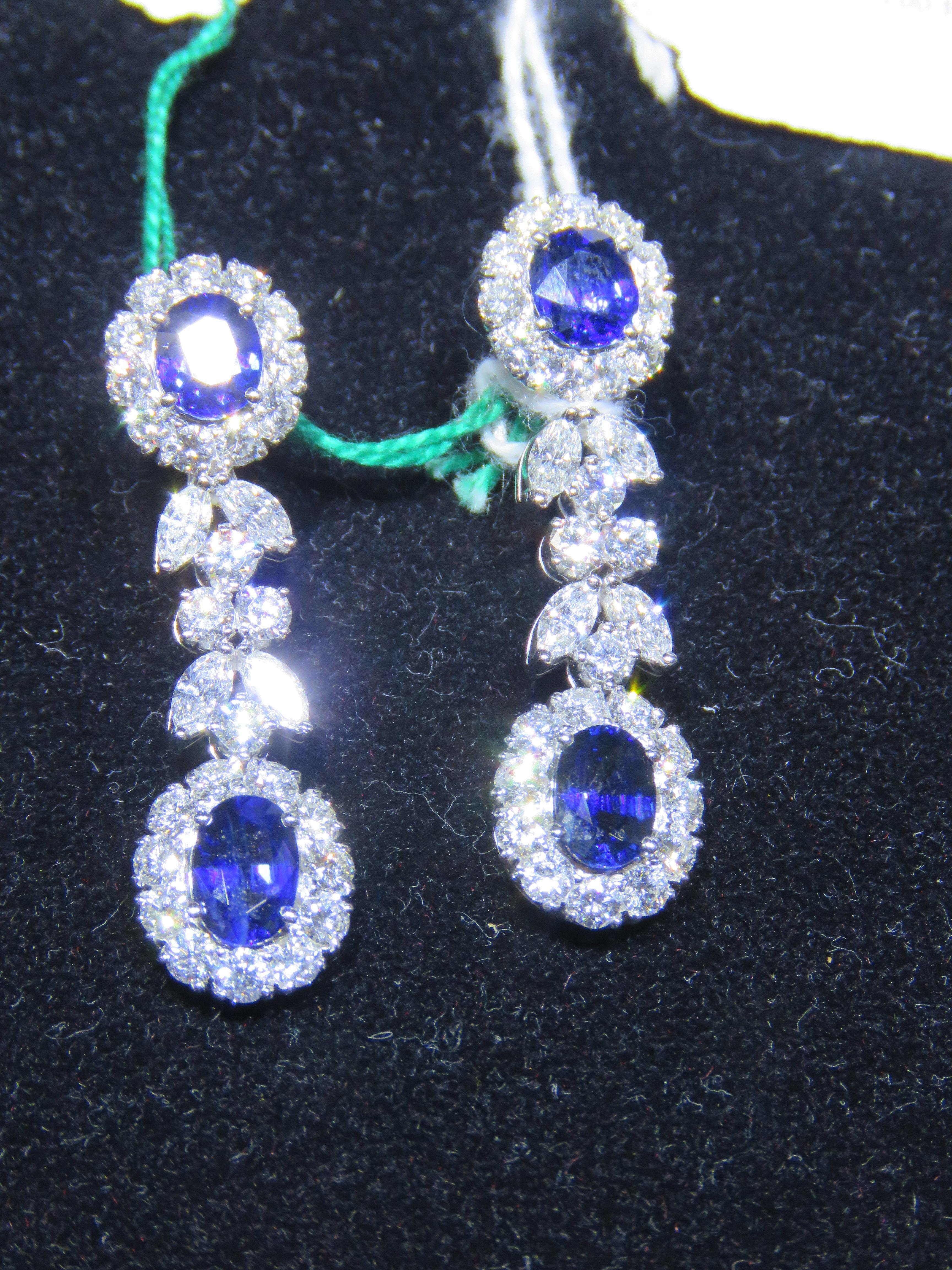 The Following Item we are offering is this Rare Important Radiant 18KT Gold Gorgeous Glittering and Sparkling Magnificent Fancy Sapphires and Diamond Dangle Earrings. Earrings contain approx 11CTS of Beautiful Rare Fancy Ceylon Sapphires and