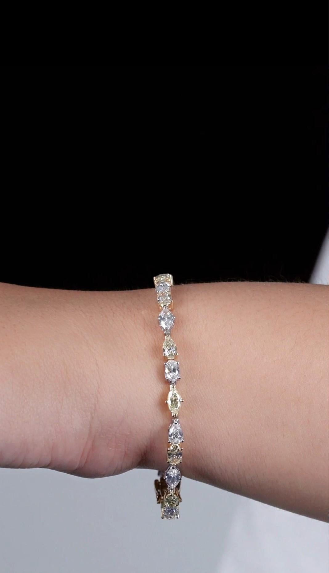 The Following Item we are offering is a Rare 18KT Gold Fancy Glittering Yellow and White Diamond Bracelet. Bracelet is comprised of Finely Set Gorgeous Glittering Yellow and White Diamonds!! T.C.W. Approx 8.50CTS!!
This Magnificent Bracelet is a