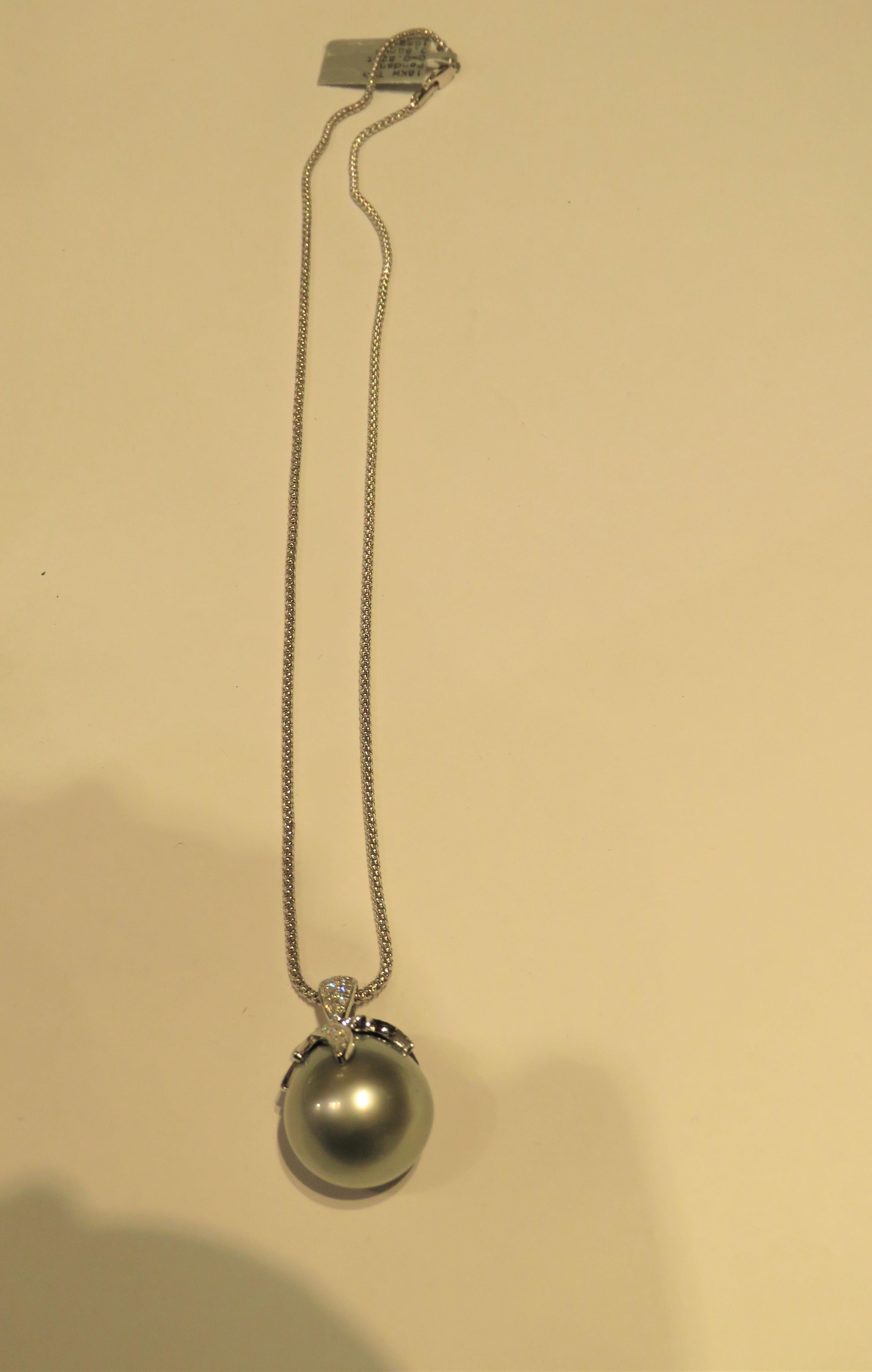 The Following Item we are offering are these Extremely Rare Beautiful 18KT White Gold Fine Large South Sea Tahitian Pearl Pendant comprised of approx. 1CT of Fine Fancy Glittering Diamonds!! This Extremely Rare Gorgeous Pearl is Highly Lustered