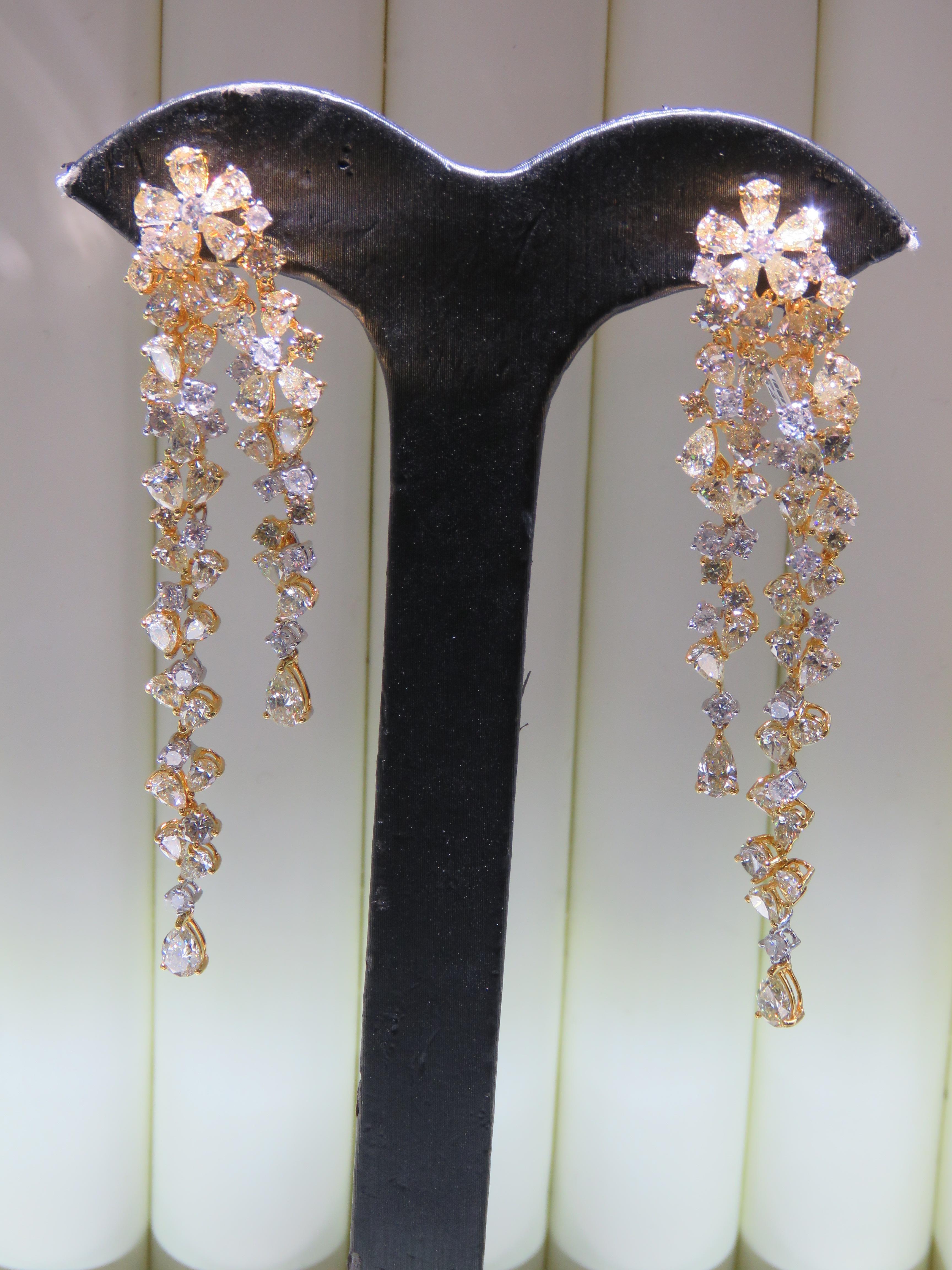 The Following Item we are offering are these Extremely Rare Beautiful 18KT Gold Fine Large Fancy Yellow and White Diamond Dangle Earrings. Each Earring features Rare Gorgeous Glittering Fancy Large Yellow Diamonds adorned with Sparkling Mixed White