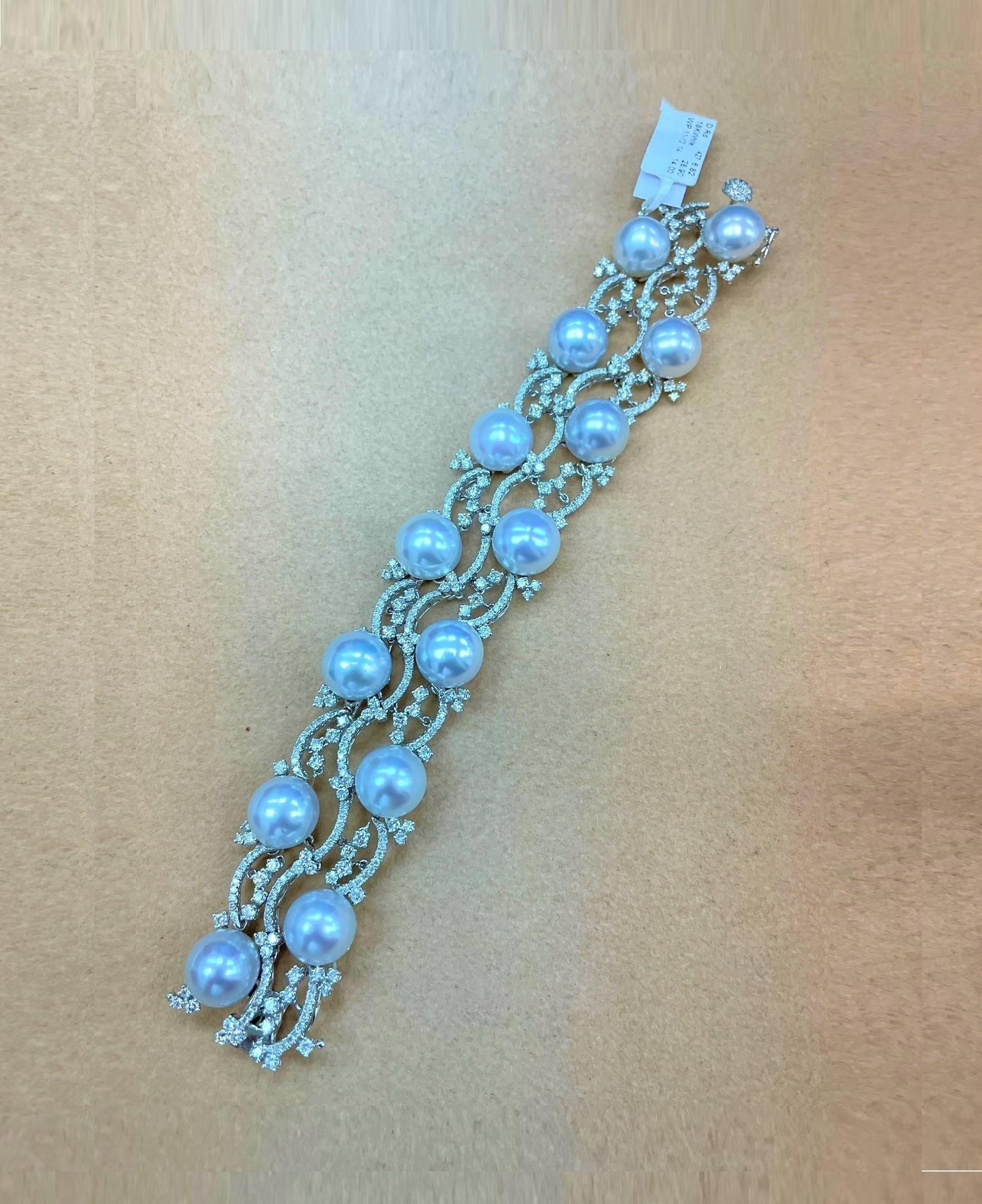 The Following Item we are offering is this Beautiful Rare Important 18KT White Gold Pearl and Diamond Bracelet. Bracelet is comprised of Beautiful Magnificent High Luster Large 14 AA-AAA SOUTH SEA PEARLS that give off a Radiant Hue!!! Beautifully
