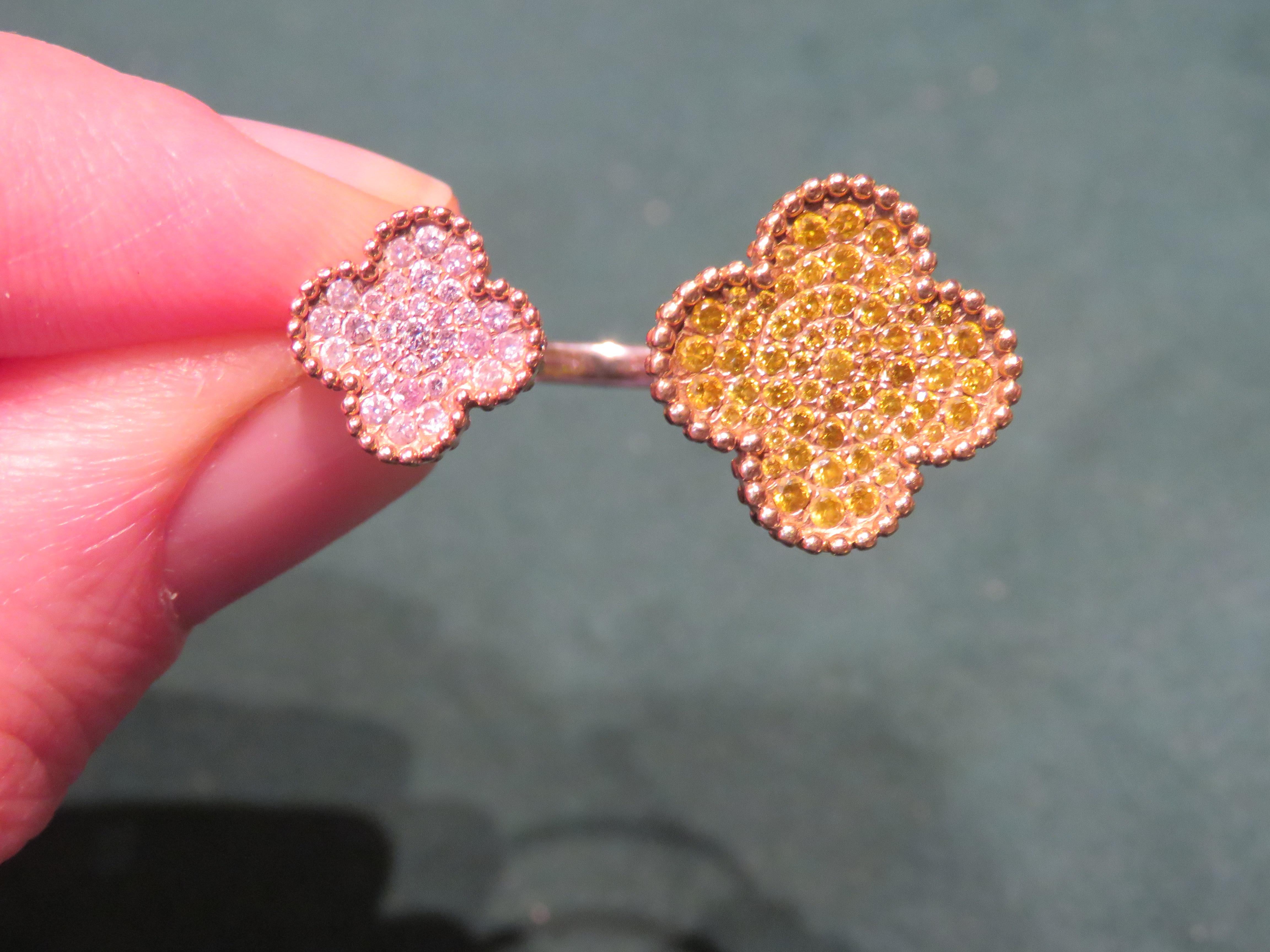 The Following Item we are offering is A Rare 18KT Gold Fancy Large Fancy Yellow Diamond Pink Diamond Clover Ring. Ring is comprised of Finely Set Glittering Gorgeous Fancy Yellow Diamonds forming a Large Clover and Fancy Pink Diamonds forming a