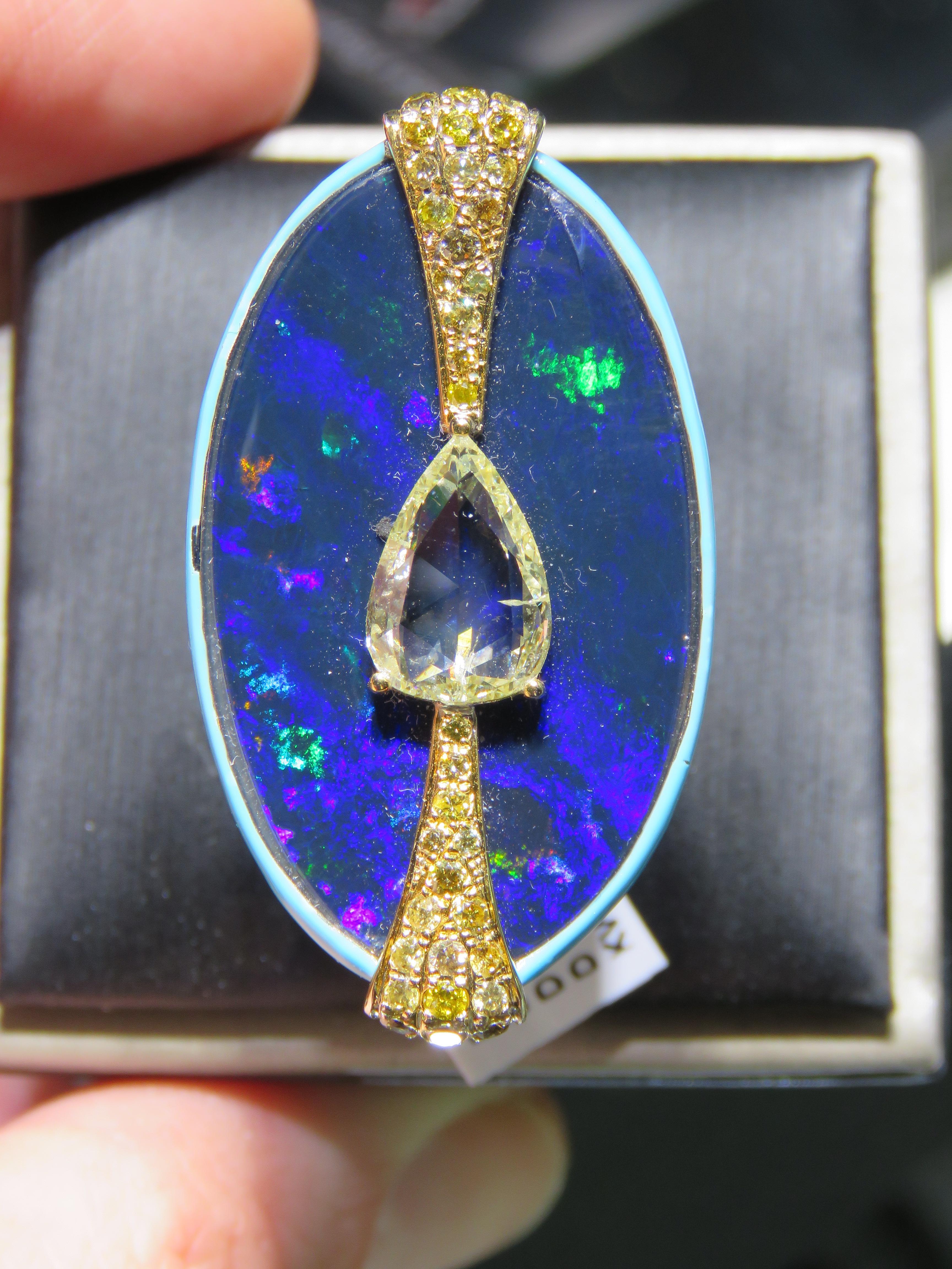 The Following Item we are offering is a Rare Important Spectacular and Brilliant 18KT Gold Large Gorgeous Black Opal Diamond Ring. Ring consists of Rare Fine Magnificent Black Opal surrounded and Framed and Surrounded by Blue Enamel and Beautiful