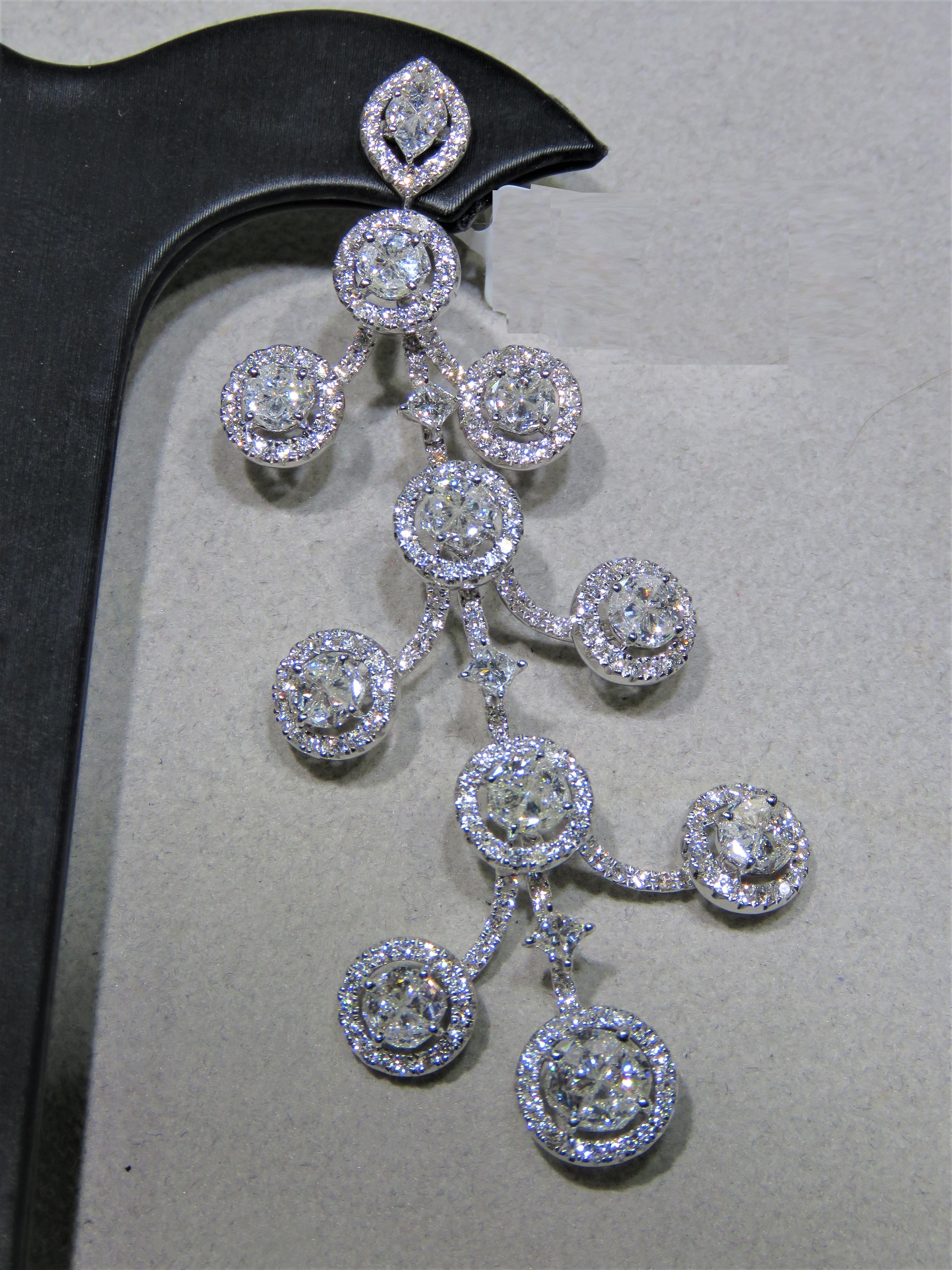 The Following Item we are offering are these Extremely Rare Beautiful 18KT Gold Fine Large White Diamond Dangle Earrings. Each Earring features Rare Gorgeous Glittering Fancy Tiers of Large Sparkling White Diamonds!! T.C.W. Approx 10.50CTS!!! The