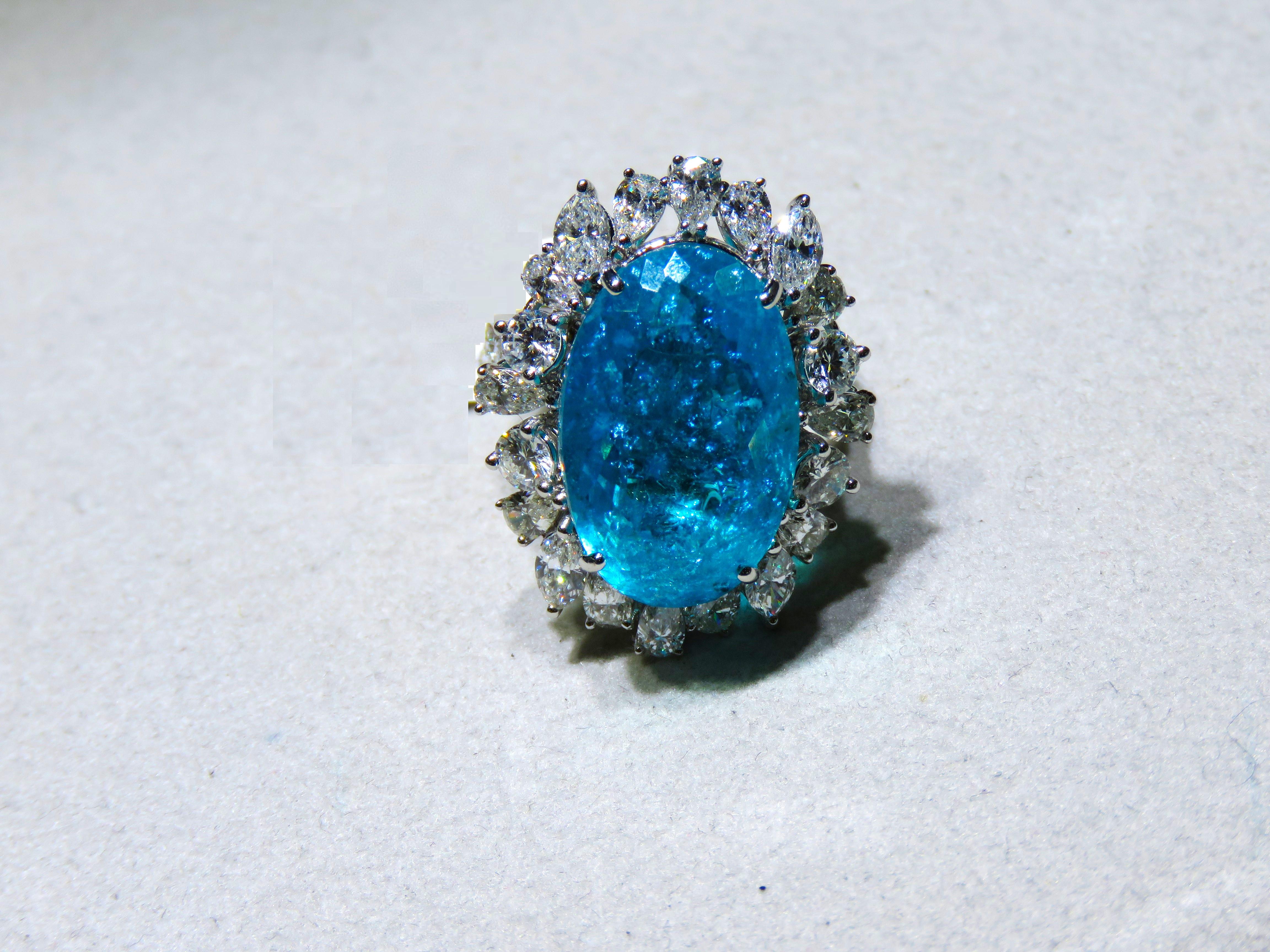 The Following Items we are offering is a Rare Important Spectacular and Brilliant 18KT Gold Large Massive Gorgeous Paraiba and Diamond Ring. Ring consists of Rare a Large Fine Magnificent Paraiba Tourmaline surrounded and Framed with Gorgeous