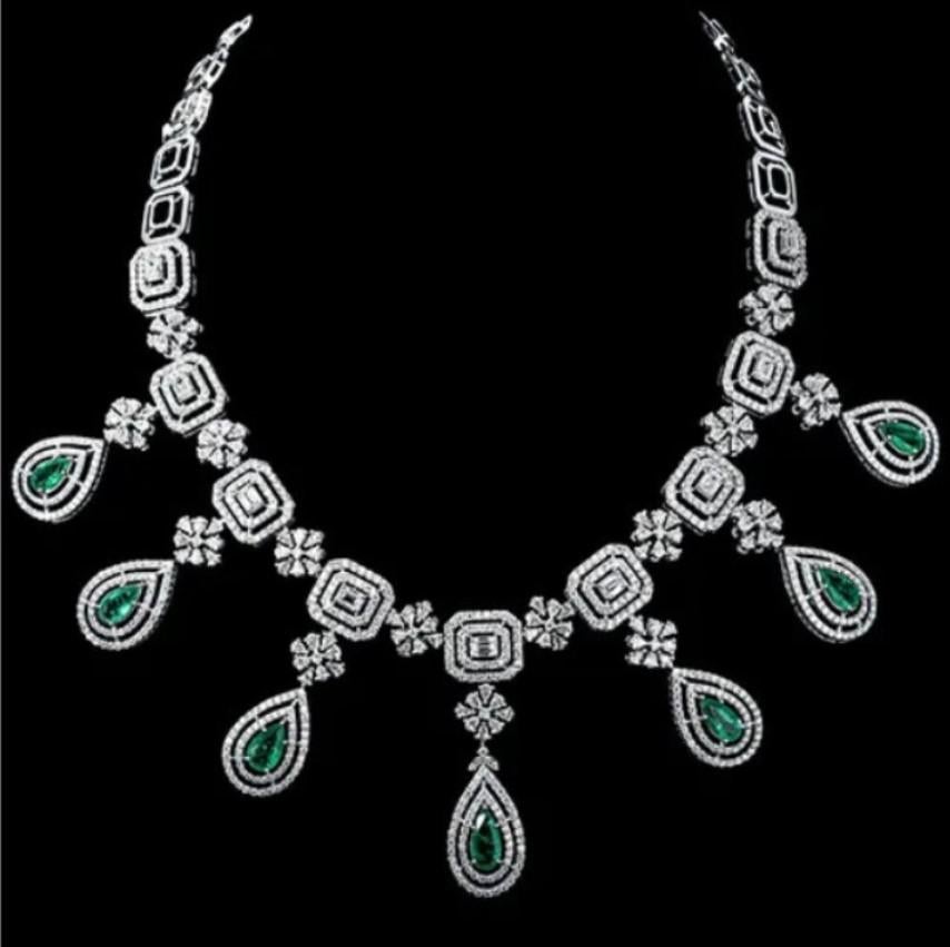 A Rare White Gold Emerald Fringe Diamond Necklace. Necklace is comprised of Finely Set Glittering Gorgeous Emeralds and Diamonds!!! The Emeralds and Diamonds are of Exquisite and Fine Quality. T.C.W. approx 22.50CTS!!! This Gorgeous Necklace is a