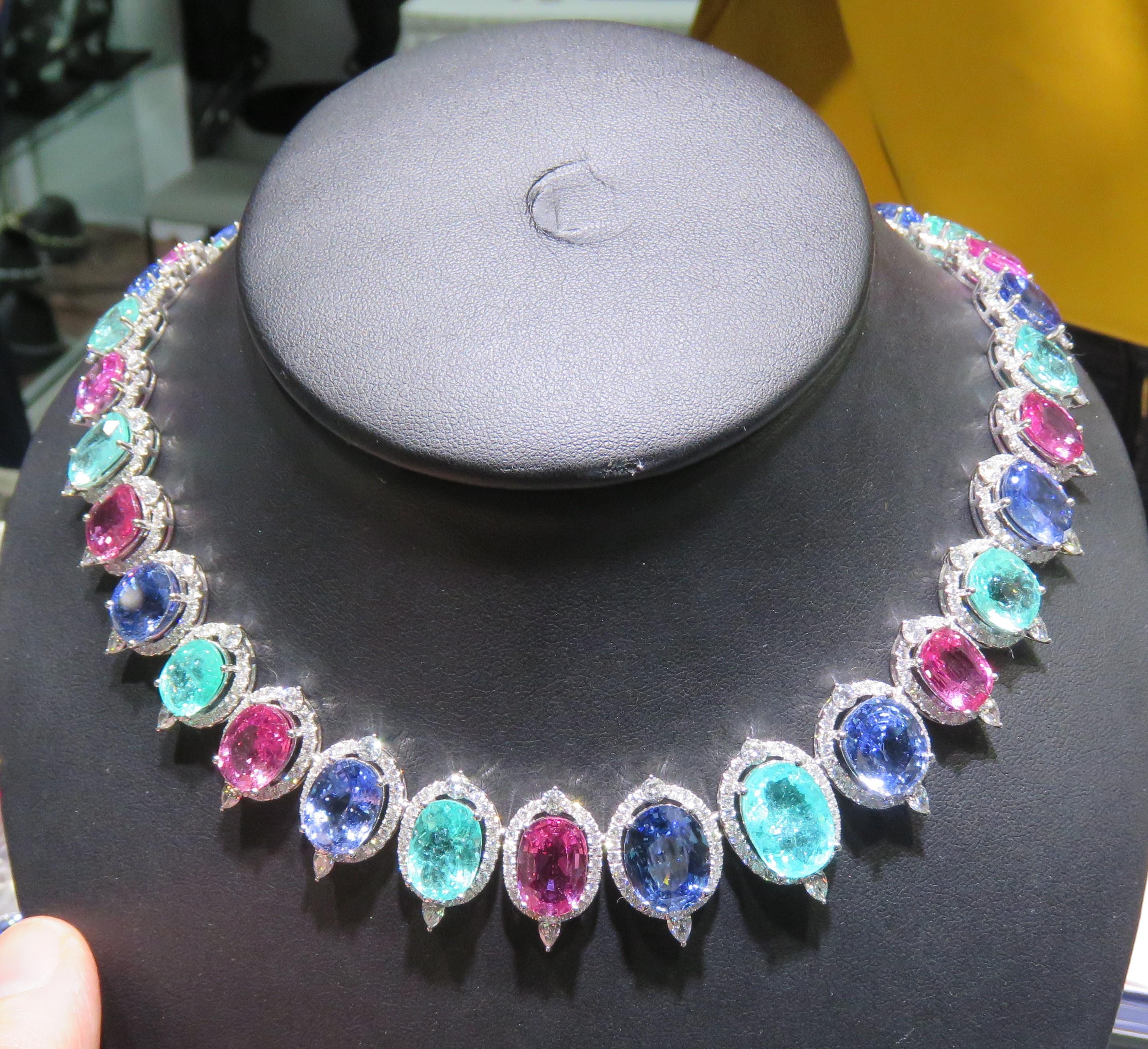 The Following Items we are offering is a Rare Important Gorgeous 18KT White Gold Exquisite Glittering Paraiba Tourmaline Purple Sapphire Blue Sapphire Necklace!!!! Necklace features Outstanding Shimmering Gorgeous Extremely Rare Fancy Oval Cut Large