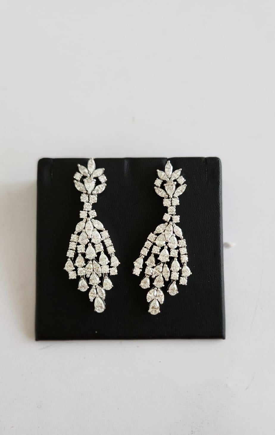The Following Items we are offering is a Rare Important Spectacular and Brilliant 18KT Gold Large Gorgeous Fancy Cascading Diamond Drop Draping Earrings. Earrings consists of Rare Fine Magnificent Fancy Glittering Diamonds. T.C.W. over 10CTS of