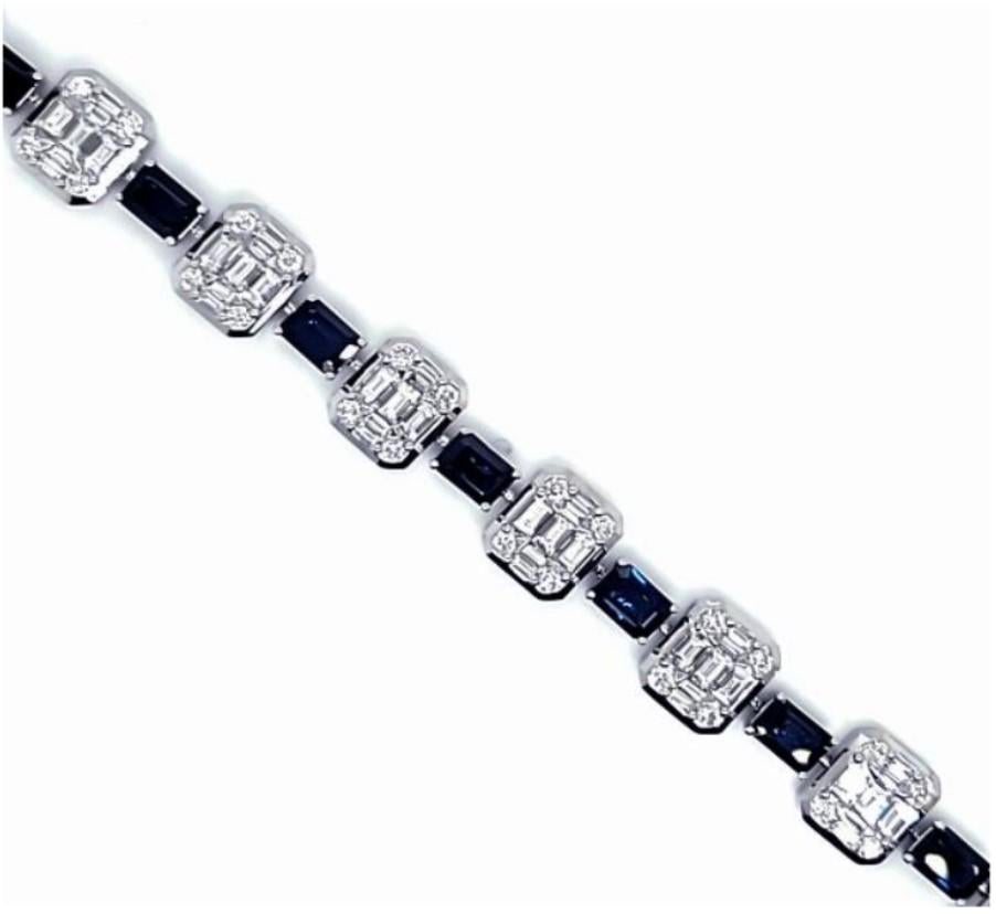 The Following Item we are offering is a Rare 18KT White Gold Large Baguette Diamond Blue Sapphire Bracelet. Bracelet is comprised of Finely Set Gorgeous Glittering Sapphires and Diamonds!! T.C.W. Approx 15CTS!! This Gorgeous Bracelet is a Rare