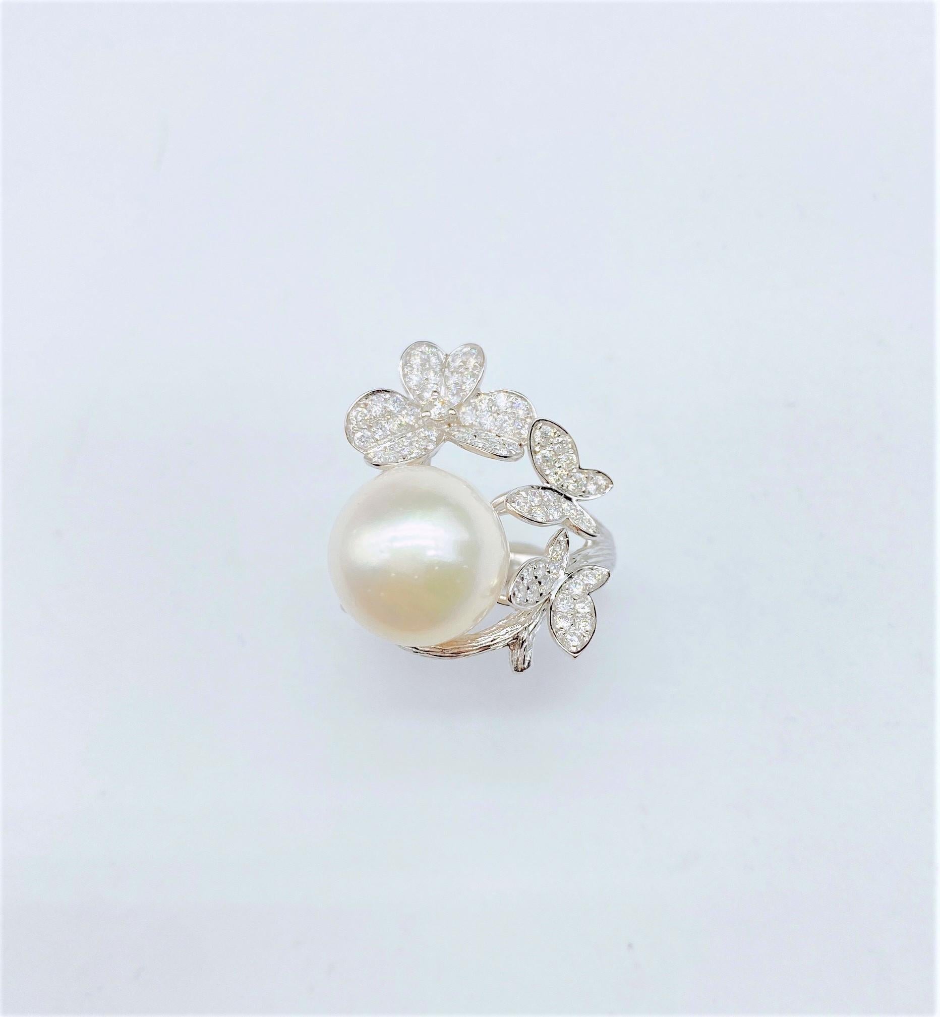 The Following Item we are offering is this Extremely Rare Beautiful 18KT Gold Fine Rare Fancy Large South Sea Pearl Fancy Butterfly Diamond Floral Flower Ring. This Magnificent Ring is comprised of Rare a Fine Large South Sea Pearl surrounded with