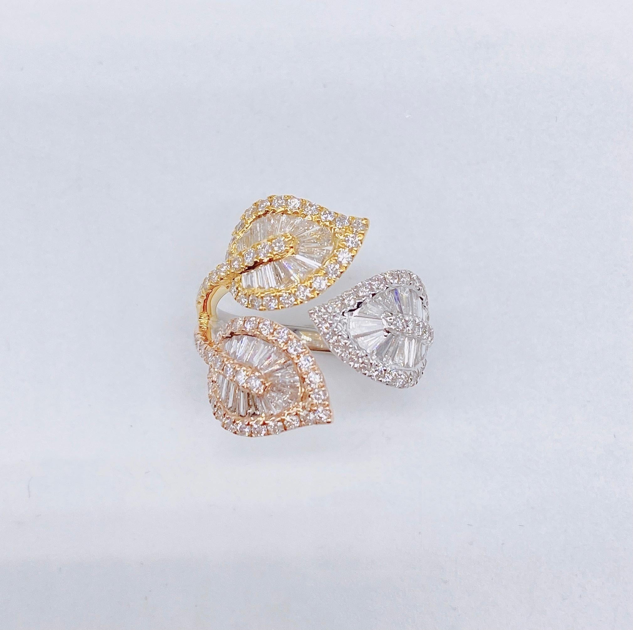 The Following Item we are offering is a Rare Important Radiant 18KT Tri Color Yellow, Rose and White Gold Large Rare Fancy Gorgeous Large Diamond Statement Leaf Crossover Ring. Ring is comprised of approx 1.50CTS of Magnificent Fancy Baguette