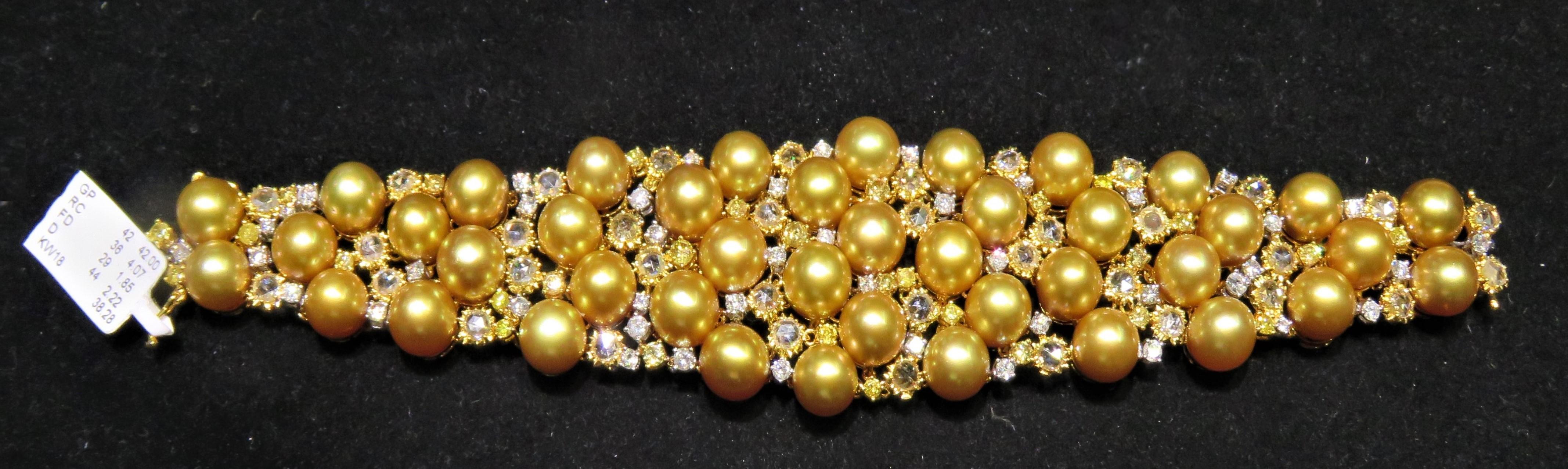 The Following Item we are offering is this Beautiful Rare Important 18KT Gold Fancy Large Golden Pearl and Fancy Rose Cut Yellow Diamond and White Diamond Bracelet. Bracelet is comprised of 42 Beautiful Magnificent High Luster Large AA-AAA GOLDEN