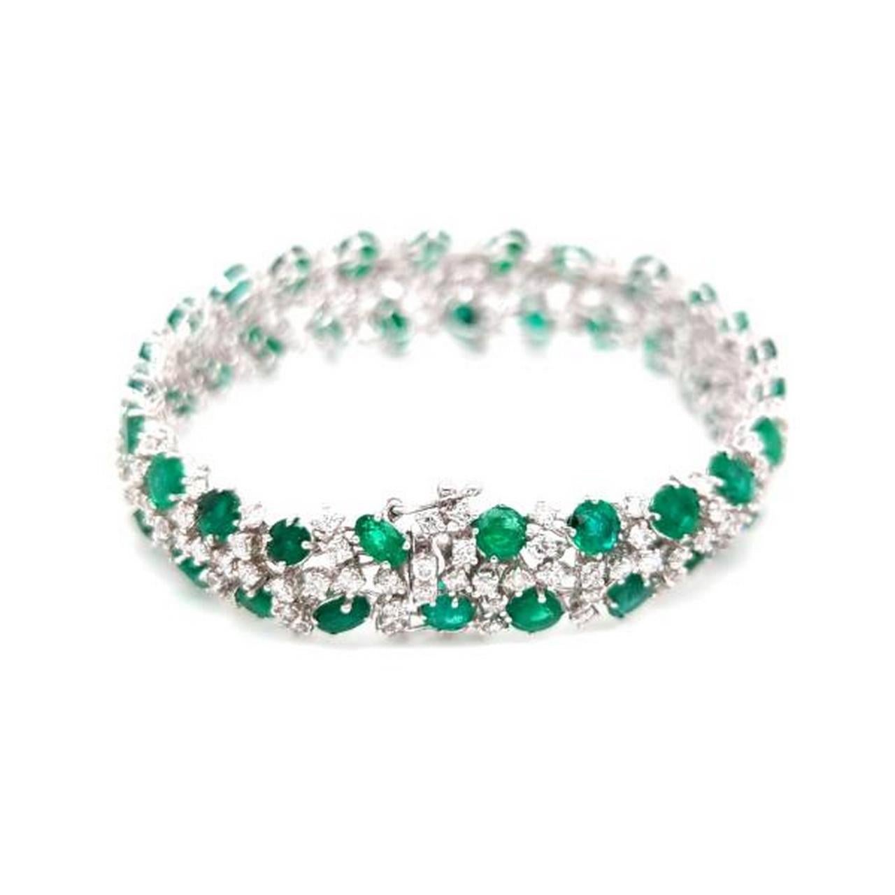 The Following Item we are offering is a Rare 18KT Gold Emerald and Diamond Bracelet. Bracelet is comprised of Finely Set Gorgeous Glittering Fancy Shaped Emeralds and Diamonds!!! T.C.W. Approx 28CTS!! The Emeralds and Diamonds are of Exquisite and