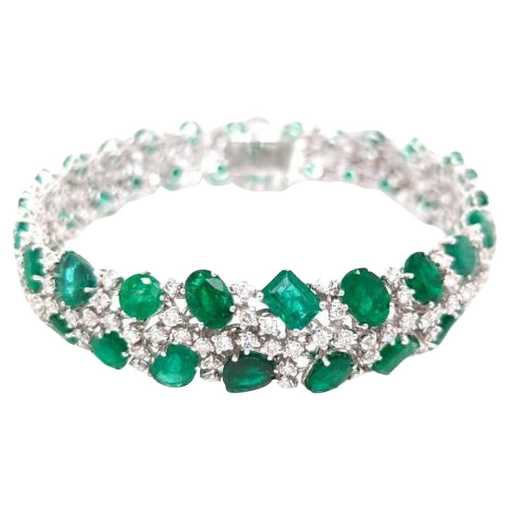 NWT 73, 989 Rare Magnificent 18KT Gold Fancy Elaborate Emerald Diamond Bracelet For Sale