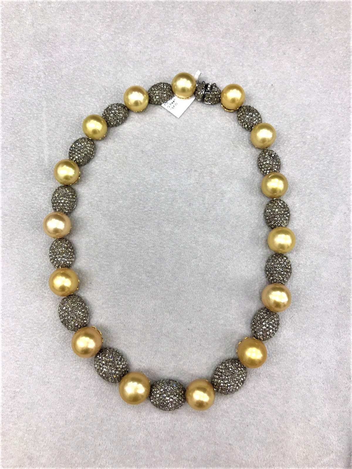 The Following Item we are offering is this Beautiful Important 18KT Gold Magnificent Rare Golden South Sea Pearl and Fancy Diamond Necklace. Necklace is comprised of 15 Beautiful Magnificent High Luster Large South Sea Golden Pearls that gives off a