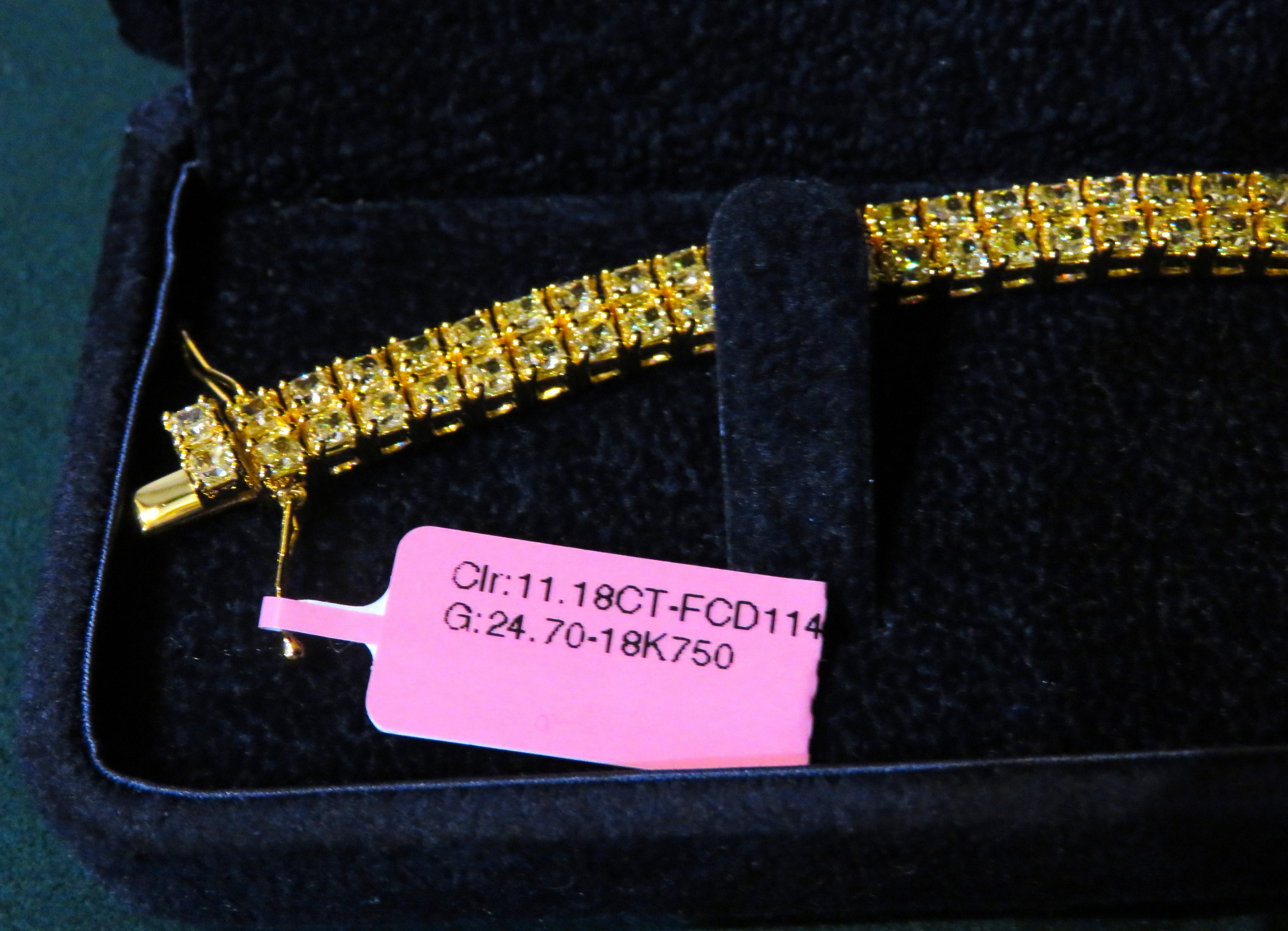 The Following Item we are offering is a Rare Important Radiant 18KT Gold Fancy Yellow Diamond Bracelet! This Magnificent Fancy Yellow Diamond Bracelet has over 11CTS of Fine Fancy Yellow Diamonds!! This Gorgeous Bracelet is a Rare Masterpiece from a